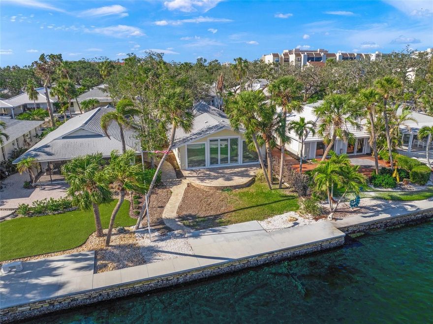 Exceptional waterfront villa on the Intracoastal Waterway in the heart of Siesta Key. Located in the highly sought-after Polynesian Gardens, this rare 3-bedroom residence offers the space and feel of a single-family home with the ease of condominium living.

Designed for seamless indoor-outdoor coastal living, the open great room is anchored by massive 10' x 9' Euro Vista folding doors, flanked by two 8' x 6' fixed Euro Vista window walls, drawing in natural light and framing unobstructed views of the Intracoastal. Step out onto your private paved-brick waterfront patio, where dolphins and manatee are frequent visitors and the water becomes your backyard.

The interior features an open living floor plan with the kitchen, dining, and living spaces connected for effortless entertaining and everyday living. An oversized garage provides ample room for vehicles, golf carts, paddleboards, and all of your island “toys.”

For boating enthusiasts, this is one of only 11 waterfront villas in the community where a private dock up to 26 feet is allowable (not attached to the seawall), offering direct access to Sarasota Bay and the Gulf of Mexico.

Polynesian Gardens is a residential island community with amenities that include a heated pool, clubhouse, community dock, and beach access points just across the street.

Perfectly positioned for an island lifestyle, you won’t need a car here. Siesta Key’s restaurants, shops, and beaches are walkable or golf-cart accessible, and the free Siesta Key trolley stops right outside the neighborhood.

This is a rare opportunity to enjoy private waterfront living on the Intracoastal with the convenience and maintenance-free ease of a condominium community.