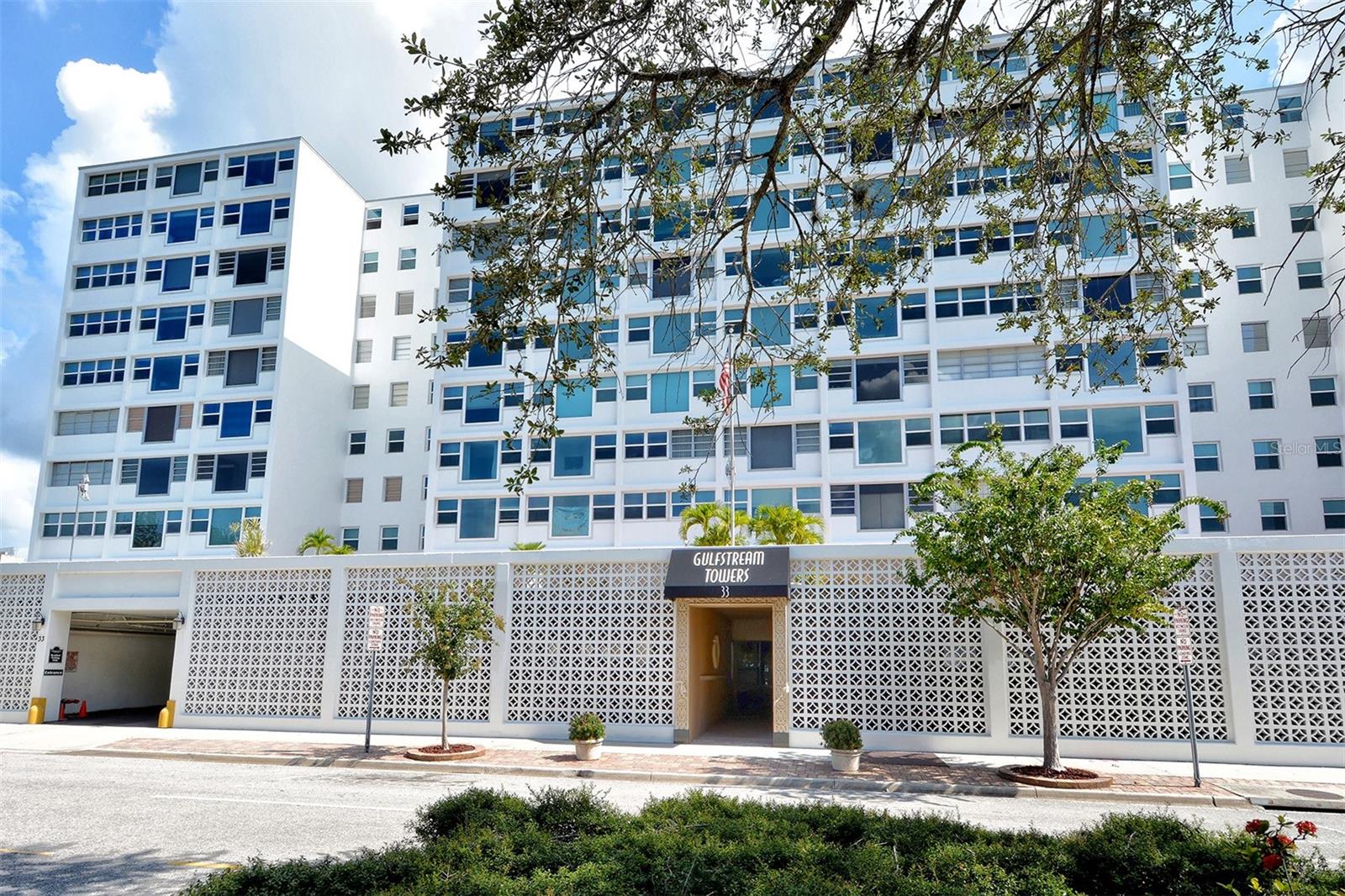 Welcome to Gulfstream Towers, an authentic Mid Century Modern building designed by modernist architect Tim Siebert located just steps away from Main Street and Sarasota’s famous Bayfront Park. This beautifully renovated 1B/1BA condo is by far the BEST value in the heart of downtown Sarasota and is perfect for seasonal and/or full-time residents. Recent updates include a completely renovated kitchen in 2019, all new COREtec vinyl flooring throughout the living area, new AC in April 2022, and custom closets/storage. If you are looking for walkability then this is your lucky day! Main Street is literally outside your front door where you will find a weekly farmer’s market, cultural events, al fresco dining, nightlife, movies, performing arts and more! The Bayfront Park and Marina Jack are just across the street where you can stroll along the waterfront admiring the fine display of watercraft, then take your pick of 3 different dining alternatives ranging from a casual tiki-bar to formal waterfront dining. If you are feeling more active you might enjoy a quick walk across the Ringling Bridge, an invigorating ride on a boat or jet ski rental across the street, or grab your bike out of the bike storage room downstairs and take the new bike lane to Payne Park where you can access the Legacy Trail that extends all the way south to Venice! Gulfstream Towers is one of the most financially stable buildings in downtown Sarasota and has been diligent in keeping up with necessary engineering inspections throughout the years. They have recently installed all new hurricane rated windows and doors throughout the building and continue to make improvements to keep the building in excellent condition. If you have been dreaming of living in Downtown Sarasota and thought it was out of your reach, THIS is your opportunity. Make your appointment today and make downtown living your new reality!