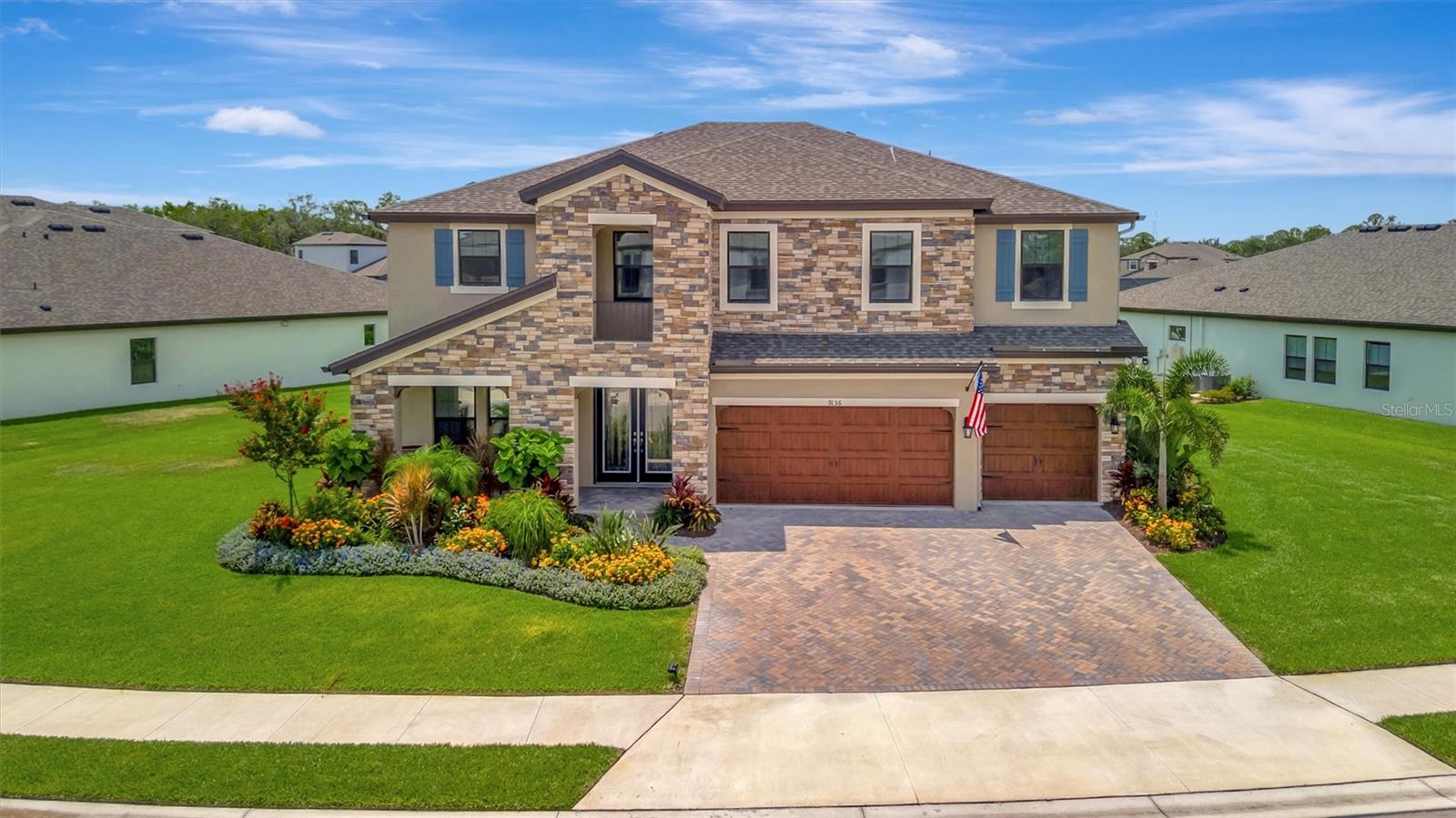 Welcome to luxury living at its finest in the amenity rich North River Ranch community. This stunning executive home offers nearly 4,000 sq ft under air and approximately 5,000 sq ft under cover, combining elegant design with everyday functionality. Inside, discover 5 spacious bedrooms, each with its own walk-in closet, and 4 full bathrooms. The heart of the home is a beautifully upgraded kitchen featuring top-of-the-line appliances, custom cabinetry, quartz countertops, and an expansive island—perfect for cooking, entertaining, and gathering with family. The open-concept floor plan flows seamlessly into the living and dining areas, with high-end finishes and thoughtful upgrades throughout. Step outside to your private outdoor oasis overlooking peaceful water views. Enjoy the resort-style pool and spa, fully equipped outdoor kitchen, and spacious covered patio, built in speakers, all enclosed within a full screened cage—ideal for year-round outdoor living. The full 3-car garage is climate-controlled with a mini-split A/C system and offers built-in storage, making it as functional as it is spacious. Enjoy piece of mind knowing your family is safe with a state of the art security system. Set in North River Ranch, you'll enjoy access to miles of nature trails, community parks, a modern fitness center, sports courts, and a family-friendly water park with slides—a perfect environment for active living. With too many upgrades to list, this home is a rare find.
Schedule your private showing today and experience the best of Florida living!