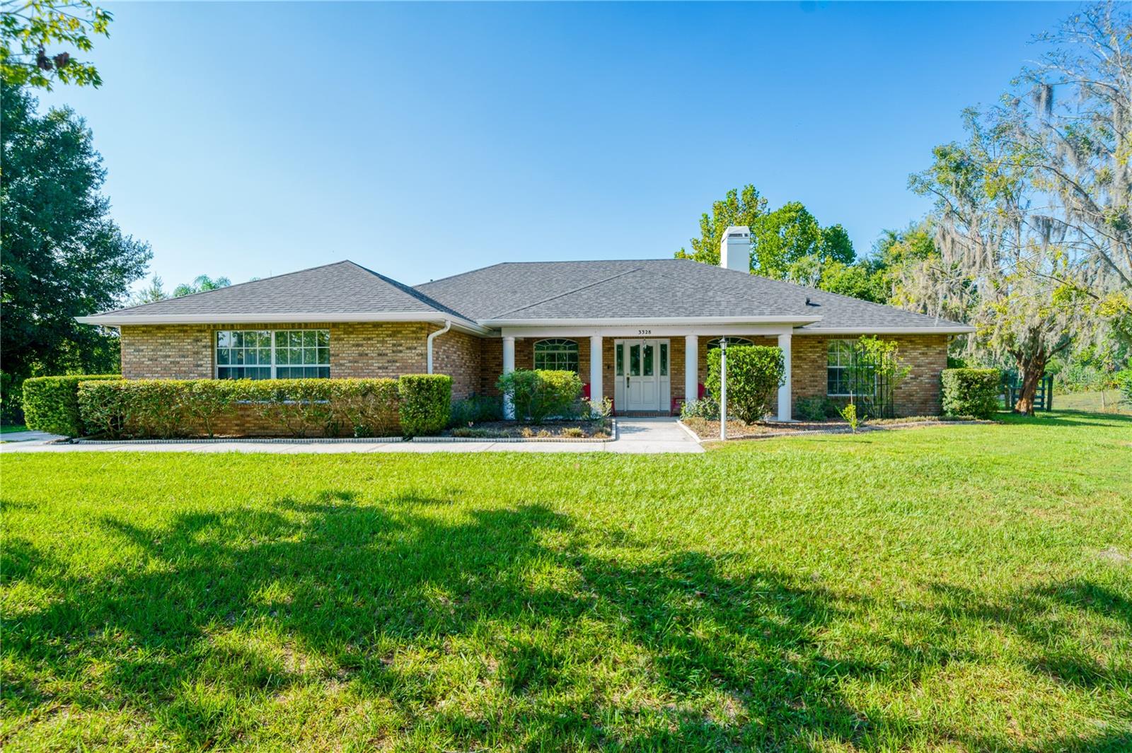 SIGNIFICANT PRICE IMPROVEMENT!! Motivated Sellers!! Bring ALL offers! This AWE INSPIRED, 3 bedroom, 2 bath + bonus room, 2 car garage home, on over 2.5 cleared and wooded acres is located in the exclusive Steeplechase community, in Kissimmee, FL! Steeplechase consists of only 28 custom built homes, with each property having 2-5 acres of land. These homes have no HOA and are zoned for horses. Every detail was chosen with meticulous care and it shows. The home itself offers a spacious open concept living area, perfect for entertaining or family gatherings. The main living area is washed in natural light . The GOURMET KITCHEN has wood cabinets, plenty of custom storage, and STAINLESS STEEL appliances. Pass through the French doors to relax and enjoy your favorite beverage on a back patio, perfect for entertaining. Enjoy BREATHTAKING views of the pool, woods, and expansive yard. This home features a split floor plan, and newer luxury engineered wood floors throughout the main living areas and owners retreat. A NEW roof (2022), Generac whole home Generator (with owned fuel tanks), and water filtration system will keep you comfortable and dry no matter the Florida weather. Great county living, convenient to shopping, dining, and entertainment, as well as being within a short drive to WORLD FAMOUS Theme Parks, Attractions and beaches. Let's face it, you can't get any more "Move In Ready" then this! Bring your EQUESTRIAN dreams, your personal touches, and schedule your showing today!!