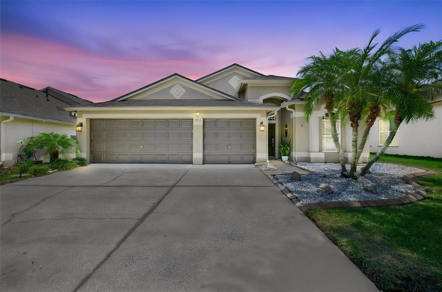 YOUR HOME SHOULD BE YOUR SANCTUARY, AND THIS IS IT! Classy home with beautiful touches on one of the largest lots in the community...over 1/3 acre! Huge backyard with new vinyl fencing to help keep your paradise private. Vastly enlarged lanai (now 900 sq ft!) with outdoor kitchen, mounted large screen tv, electrical outlets at every corner plus, and hot tub with room enough for  . Plenty of space for a great backyard party with family and friends. You could even add a pool and still have green space left. Inside under the NEW ROOF, the air is perfect thanks to the new HVAC system (mid 2025). You will find rich engineered wood flooring everywhere except the wet areas which are tiled.There is professionally installed wood trim finishes, crown molding, tall baseboards and wood valances over the windows through the home. The kitchen is open to the spacious family room and has NEW Appliances (3 year warranty on the refrigerator), granite counters, stone backsplash, 42" upper cabinets, and pull-outs in the lower cabinets. You will love the extra storage space in the walk-in pantry.  Speaking of sanctuaries, the Primary Bedroom crown molding has an extra special touch with lighting above it. And make sure you don't miss the large walk-in closet! The en-suite bath has dual sinks, granite counters, and the shower and separate tub have tile with listello. The front (4th) bedroom could make a great office but it does have a closet so it is a true bedroom. One of the secondary bedrooms has a walk-in closet. All bedrooms have engineered wood floors so there is no carpeting at all. The 3 car garage has a workshop with plenty of storage cabinets for the handy person in the family. AND there is a ceiling mounted large screen tv that swivels so you can watch that game while you are getting a project done! There are so many thoughtful upgrades...even outside outlets to easily plug in your Christmas lights! Inside the Covington Park Community is Doby Elementary which is an easy walk from this property. Eisenhower Middle and East Bay High are right across from the neighborhood entrance. Amenities include a family pool, lap pool, large fitness room, clubhouse you can reserve for parties, sports courts, playground, and family activities several times a year. Shopping and restaurants within a short drive. Easy access to I-75, US 41 and Hwy 301.