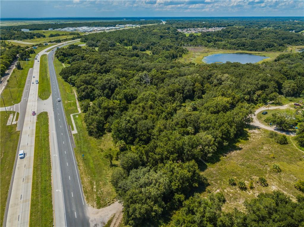 This sale includes 3 parcels totaling 40.14 acres with more than 20 acres in uplands. There is 1900 +/- feet of road frontage on Highway 441. This land is currently zoned P-D on the 2 larger lots and A-1 vacant residential on the 1.24 acre parcel on the front. Only the small church and 1 residence have ever been built. This land is available for a new P-D project with Orange county. There is tremendous growth beginning with the completion of the 429 western beltway. Hwy 441 has 36,000 cars per day in traffic count.