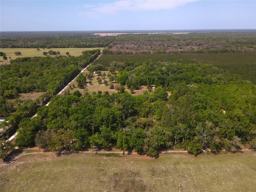 Ten acre homestead located in Chiefland on a paved Road. Mixture of woods, pasture, & homestead yard, with a small pond.  Just a few minutes from downtown Chiefland & Manatee Springs.  Property has a Pole Barn/Garage Workshop, well, septic, and 1991 Manufactured Home that is 1620 square feet.  The home is in poor condition, sold AS IS. Please use extreme caution in viewing the property, recommended that you not enter the home.  Property will require some cleanup.  There are 2 gates to enter the property.  Located next to a cattle farm providing a quiet farm style setting. Property offers a lot of upside.  Not in a Subdivision. Property sold “AS IS”.  Many large hardwoods are present on the property.  A must see!