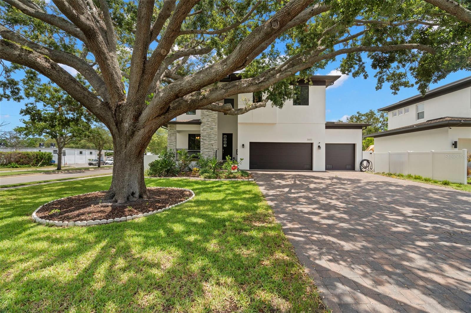 Stunning 2019 designer home in the highly desirable Bel Mar Shores neighborhood, west of Westshore Blvd, this impressive residence offers the perfect blend of luxury, location, and lifestyle. Zoned for top rated Mabry, Coleman and Plant school district. Spanning nearly 3,400 square feet, this thoughtfully designed 4-bedroom, 4-bathroom home includes an expansive upstairs loft and an oversized 3-car garage—perfect for modern living. Step inside to find rich wood flooring, designer tile selections, and elegant granite countertops throughout. The open-concept kitchen is a chef’s dream, complete with a double oven, beautiful cabinetry, and a spacious island that flows seamlessly into the main living areas—ideal for entertaining. Upstairs, the owner’s suite serves as a true sanctuary, featuring a spa-inspired bath with dual vanities and a large walk-in closet. The spacious backyard offers plenty of room for outdoor play, and features a charming brick-paved area, perfect for relaxing or entertaining. Just minutes from Tampa’s top shopping, dining, and only a 10-minute drive to the airport, this home places you at the center of it all.
