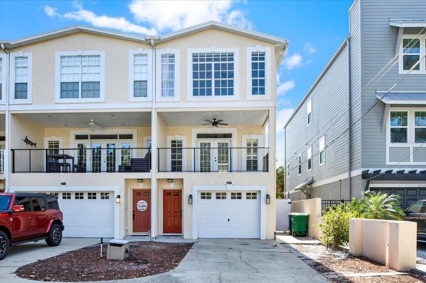 THREE-STORY TOWNHOME JUST OFF BAYSHORE BLVD. Welcome to this gorgeous 3-bedroom, 3-bath townhome in the highly sought-after Bayshore. This beauty features elegant hardwood/vinyl floors, an expansive balcony, and a private fenced backyard. The kitchen boasts expansive cabinet space, granite countertops, a wine cooler, stainless steel appliances, and a large center island perfect for hosting guests and dinner parties. The oversized Owner's Suite features two walk-in closets with custom closet systems and shelves. The Owner's Suite bathroom features his-and-hers sinks and a spacious garden tub. The remaining two bedrooms feature private bathrooms and ample closet space. This desirable Bayshore location is close to shopping, dining, and many beaches. From here, it's minutes to downtown Hyde Park, Tampa General Hospital, Amalie Arena, and Ballast Point Park. Pick up groceries close to home at Publix, The Fresh Market, Winn-Dixie, and Sprouts Farmers Market. You will love walking to Bayshore Boulevard, which is ranked among the longest continuous sidewalks in the world. Bikers, walkers, and strollers enjoy unparalleled views as they wander from Gandy Boulevard to downtown. Hurry up and schedule your showing today! Furnished negotiable.