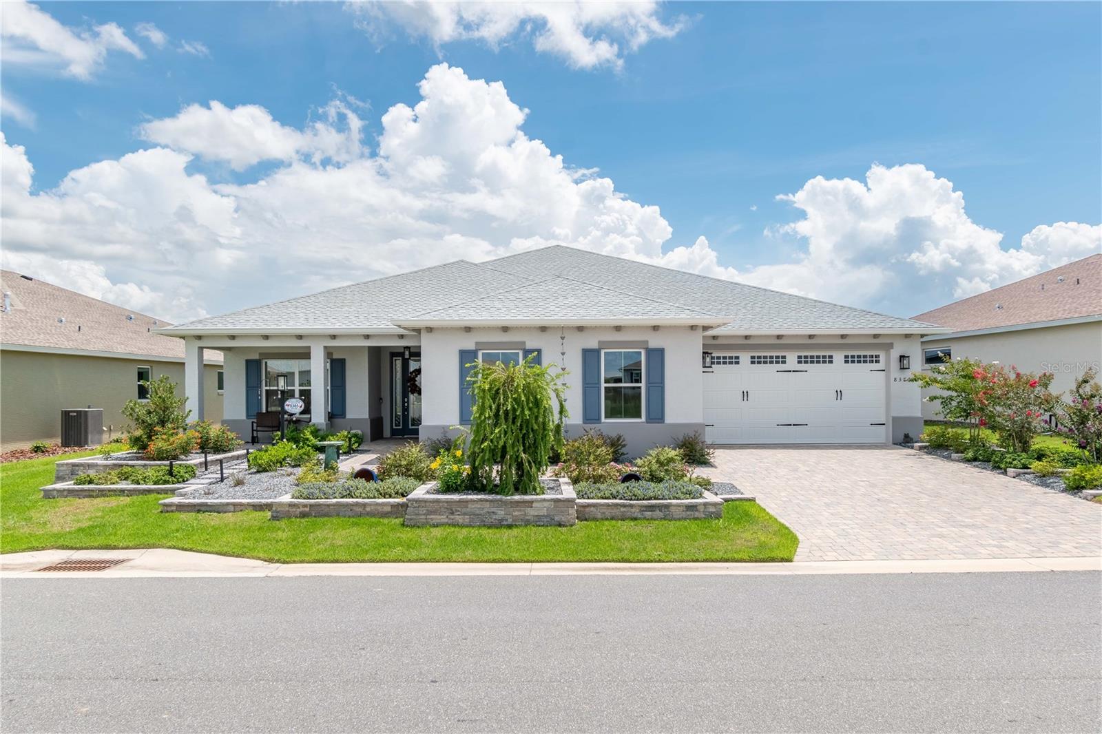 Stunning and move-in ready, this 2024-built 2-bedroom, 2.5-bath home is located in the sought-after Ashford neighborhood of Candler Hills. Thoughtfully designed with both elegance and functionality in mind, this home features a beautifully landscaped exterior with custom hardscape elements for easy, low-maintenance living. Inside, you'll find a wealth of upgrades including luxury vinyl plank (LVP) flooring throughout, soaring high ceilings, and detailed crown molding that adds a touch of sophistication to every room. The designer kitchen is a chef's dream, complete with soft-close, staggered cabinetry, quartz counters, gas cooktop, farm sink and modern finishes. A spacious 3-car garage offers ample storage and versatility. This home truly combines style, comfort, and convenience in one of the area's most desirable communities. The HOA fee includes 2 private recreation centers including The Lodge, and additional 3 Recreation centers for On Top of the World, pools-indoors and outdoors, state of the art gyms, racquet ball courts, tennis courts, covered Pickleball courts, library, miniature golf, dog parks, basketball, bocci ball, softball, horseshoes, common grounds maintenance, park like settings with benches for your walks, security gates for your safety and much more.