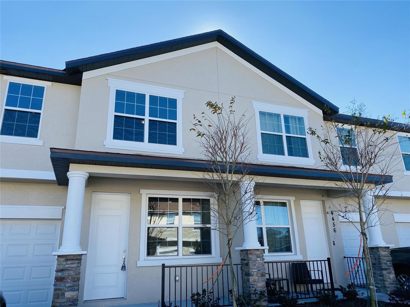 Spacious 4BR/2.5BA townhouse in a gated community with open-concept living, granite countertops, and stainless steel appliances. Large primary suite with walk-in closet. Private patio and resort-style amenities including pool, gym, clubhouse, and playground. Minutes from Disney, shopping, dining, and major highways. Ideal for primary residence, vacation home, or investment property. Schedule your showing NOW, THIS HOME WILL NOT LAST.