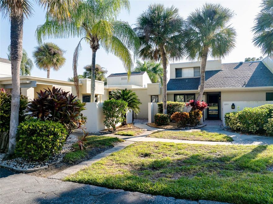 A Remarkable Opportunity in the popular Meadows community near UTC in Sarasota!  Step into this stunningly remodeled 2 bedroom, 2 bath residence offering an open layout and expansive views of the golf course and community pool.  Flooded with natural light, this home truly shines with its top-to-bottom renovations featuring premium finishes throughout.  Nearly every element has been replaced, including high-value upgrades such as brand-new hurricane-rated windows and doors, a new AC system, hot water heater, luxury vinyl plank flooring throughout, and all new appliances—including washer and dryer.  The kitchen and both bathrooms have been completely redesigned with modern, upscale style.  The gourmet kitchen opens seamlessly to the dining and living areas and showcases stainless steel appliances, a quartz waterfall breakfast bar, and sliders that lead to the enclosed lanai and open patio beyond.  The living room impresses with three sets of hurricane-impact sliders that frame serene golf course views, plus a stylish feature wall (that matches the dining room with a fireplace insert).  The spacious primary suite feels like a private retreat, offering two closets, dual sinks, a walk-in shower, and its own patio overlooking the golf course.  The guest bedroom is thoughtfully positioned on the opposite side of the home with an adjoining updated bathroom for added privacy.  You can have peace of mind for years to come with the newer roof (2024) and all new hurricane windows/doors, plus low electric bills.  Live like you’re on vacation year-round in The Meadows—one of Sarasota’s most desirable communities!  Move right in and enjoy all that Florida has to offer with all grounds maintenance taken care of by the Association, along with the exterior maintenance of the building and pest control.  Conveniently located off Honore near University Parkway, you’ll enjoy close proximity to Lakewood Ranch shopping and dining, but with less congestion.  All exterior mainatence (including the new roof) is included in the REASONABLE monthly fee, which also includes all of the Meadows amenities.   Amenities include a clubhouse, heated community pool, fitness center, 8 new tennis courts, pickleball, playground, and 3 golf courses, all set among beautifully landscaped grounds with miles of walking and biking trails and lakes.  Country Club membership is optional, and The Meadows Golf Courses are set to open very soon!  Just minutes from world-famous Siesta Key Beach, other Gulf Coast beaches, St. Armands Circle, and major sports complexes, this location truly offers the best of Sarasota living.