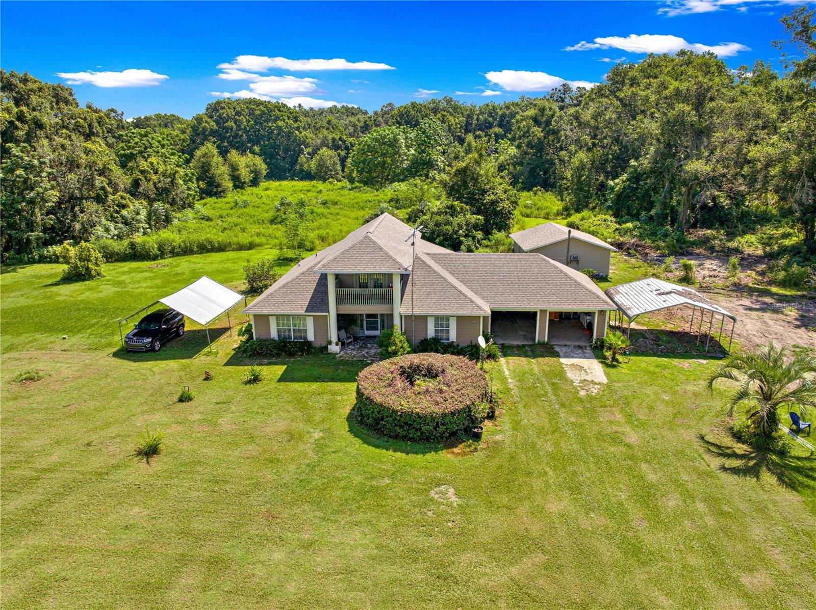 Discover the charm and comfort of this spacious 4-bedroom, 2-bath home nestled on a beautiful 5-acre property. From the moment you arrive, you’ll love the wide-open space, the lush green lawn, and the incredible sense of privacy this home offers.
Inside, you’ll find a welcoming living room, a formal dining area, and a well-equipped kitchen that’s perfect for family meals or entertaining guests. An office space adds convenience for working from home, while the laundry room keeps everything practical. Upstairs, a bonus room with its own private balcony provides the perfect spot to enjoy your morning coffee while overlooking your land.
The home also features a 2-car garage, a back utility room, and two carports, giving you plenty of room for vehicles, storage, or hobbies. Outdoors is where this property truly shines—enjoy evenings in your very own gazebo, summer barbecues on the lawn, and endless opportunities to garden, play, or simply relax under the open sky.
This isn’t just a house—it’s a lifestyle. A rare chance to own a versatile property with space to grow, create, and enjoy the peaceful country life you’ve always dreamed of.