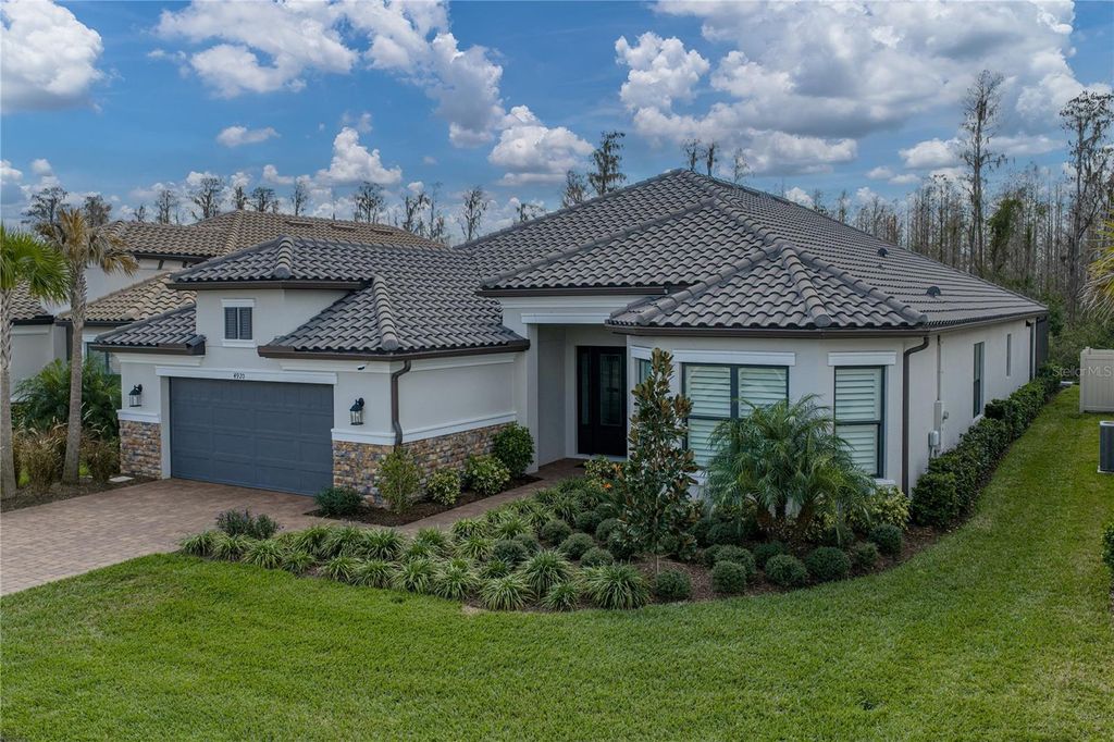 Photo of 4920 Freccia Loop, Wesley Chapel, FL 33543 (MLS # TB8465731)