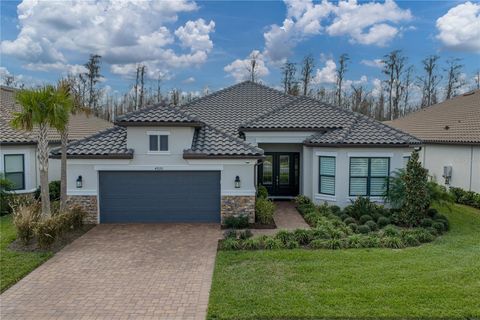 Photo of 4920 Freccia Loop, Wesley Chapel, FL 33543 (MLS # TB8465731)