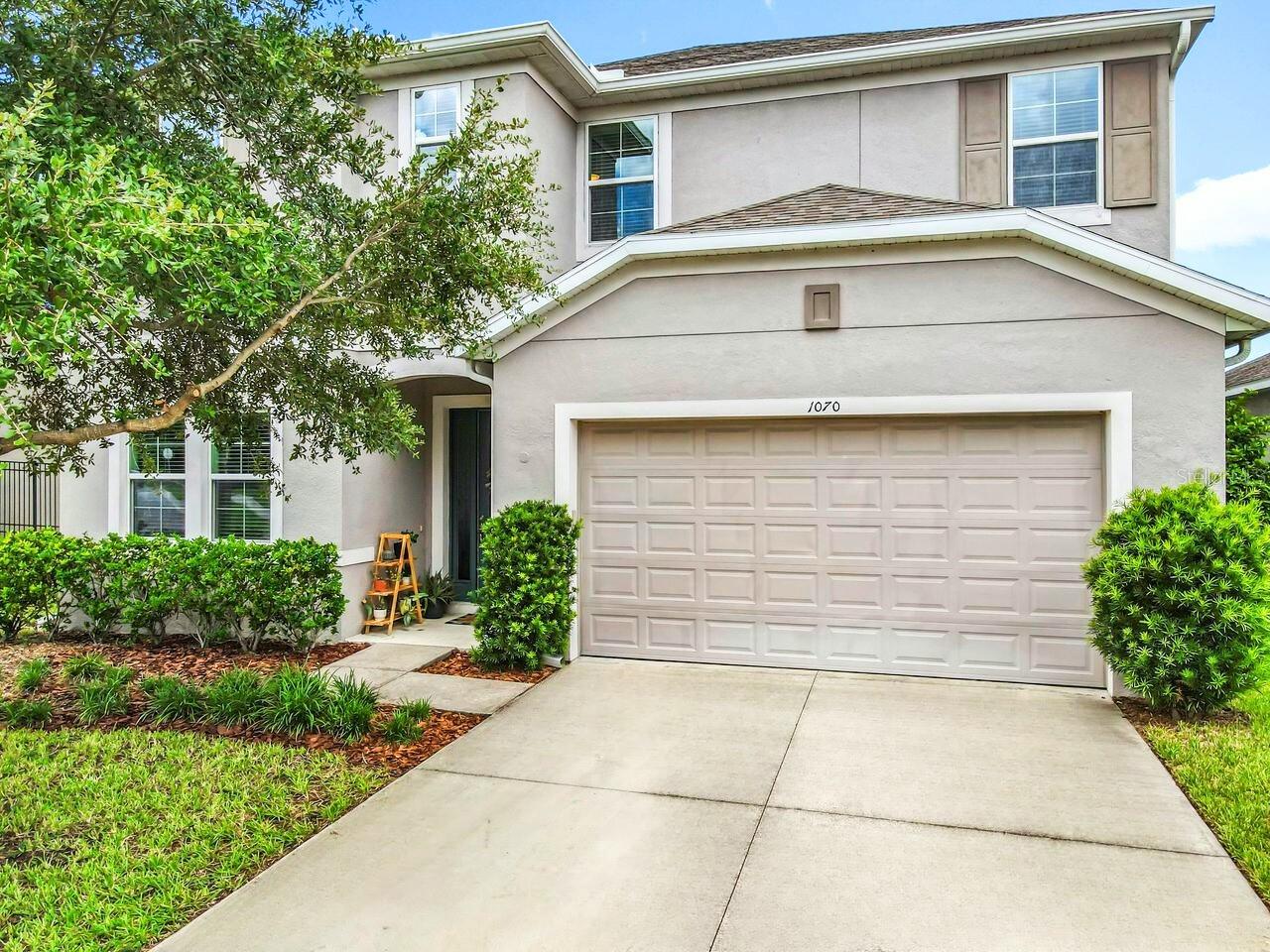 Immaculate 5BR/4.5BA + Office + Loft in Hilltop Reserve! This 3,685 sq. ft. 2-story residence combines modern style, casual comfort, and thoughtful design to create a truly turnkey residence. Nestled in a picturesque neighborhood with no rear neighbors and directly across from the resort-style pool, splash zone, and amenities, this home offers space and versatility for families, entertaining, and working from home.
Step inside to an open floor plan with high ceilings, 18" gray ceramic tile floors, custom paint, and designer fixtures & finishes throughout. The gourmet kitchen features Aristokraft shaker cabinetry with brass hardware, granite countertops, a massive island with seating, walk-in pantry, and premium GE stainless steel appliances including a gas range with griddle. Adjacent is a casual dining area, perfect for everyday meals, while the formal dining room sets the stage for elegant gatherings. A private home office with double glass doors, a guest bedroom with full pool bath, command center "nook" and a convenient half bath complete the main level.
Upstairs, enter through French doors to the luxurious owner’s retreat, with spa bath including double vanities, whirlpool tub, glass-enclosed shower, and huge walk-in closet. Three additional bedrooms provide flexible living space, including a Jack-and-Jill bath and a full bath, while the loft offers an ideal space for a media/game room, playroom, or home gym.
The freshly painted patio overlooks a fully fenced backyard with a fire pit and large cantilever umbrella, perfect for outdoor entertaining and relaxing.
Hilltop Reserve is a well-maintained, family-friendly community with a resort-style pool and splash zone, outdoor dining area, playground and a small soccer/recreation field. Conveniently located near SR 414 & SR 429, residents enjoy easy access to Apopka's refreshing springs, shopping, dining, and entertainment, plus a short drive to historic Winter Garden, Mt. Dora, Winter Park, downtown Orlando, chains of lakes and beaches!
This home is move-in ready with custom finishes, designer touches, and thoughtful upgrades throughout—truly a model-home quality property in one of Apopka’s most sought-after communities. Don’t miss this exceptional opportunity!