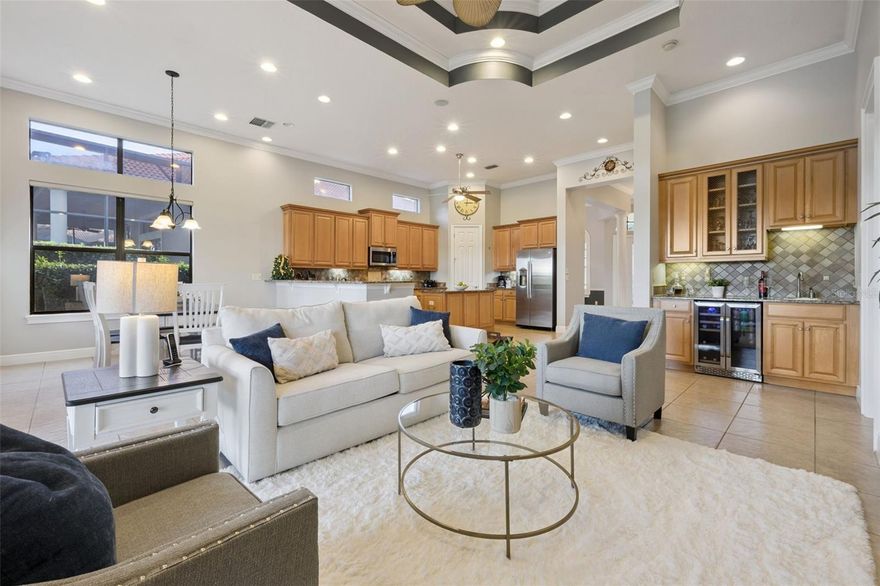 SPANISH MEDITERRANEAN LUXURY in LAS COLINAS located within the MISSION RESORT COMMUNITY, offering direct access to resort amenities, dining, and recreation. This 4-bedroom, 3.5-bath residence is positioned along a quiet street that leads to the cul-de-sac, providing a peaceful setting with GOLF COURSE VIEWS and ILLUMINATED STONE-BRIDGE VIEWS visible from multiple rooms throughout the home. Inside, elevated design elements include 12–14 FT CEILINGS, CROWN MOLDING, abundant natural light, and an open layout that blends everyday comfort with timeless Mediterranean character. The kitchen features 48" CABINETRY, GRANITE COUNTERTOPS, NATURAL GAS COOKING, stainless appliances, and a WATER SOFTENING/FILTRATION SYSTEM, all oriented toward the golf course. A rare highlight is the presence of TWO FULL PRIMARY SUITES, one on the main floor and one upstairs, ideal for MULTI-GENERATIONAL LIVING or private retreat setups. The upstairs suite includes a PRIVATE BALCONY OVERLOOKING THE FAIRWAY & BRIDGE, illuminated each evening for a tranquil, resort-like atmosphere. Additional features include a WET BAR, ceramic tile flooring, warm architectural detail, and scenic golf views from the living areas, the kitchen, and several bedrooms. As a resident of LAS COLINAS WITHIN MISSION RESORT, you have direct access to TWO CHAMPIONSHIP GOLF COURSES, THREE ON-SITE RESTAURANTS, a FULL-SERVICE SPA, TENNIS, PICKLEBALL & BEACH TENNIS COURTS, a HEATED OUTDOOR POOL & HOT TUB, a FITNESS CENTER, walking paths, and lakeside access. MEMBERSHIP REQUIRED FOR AMENITY ACCESS, SOCIAL OR GOLF SOCIAL MEMBERSHIP OPTIONS OFFERED. Located minutes from Mount Dora, Tavares, and central Florida lakefront dining, with convenient proximity to Orlando attractions, airports, and both coasts, this home delivers a lifestyle of COMFORT, ELEGANCE & TRANQUILITY at $565,000.