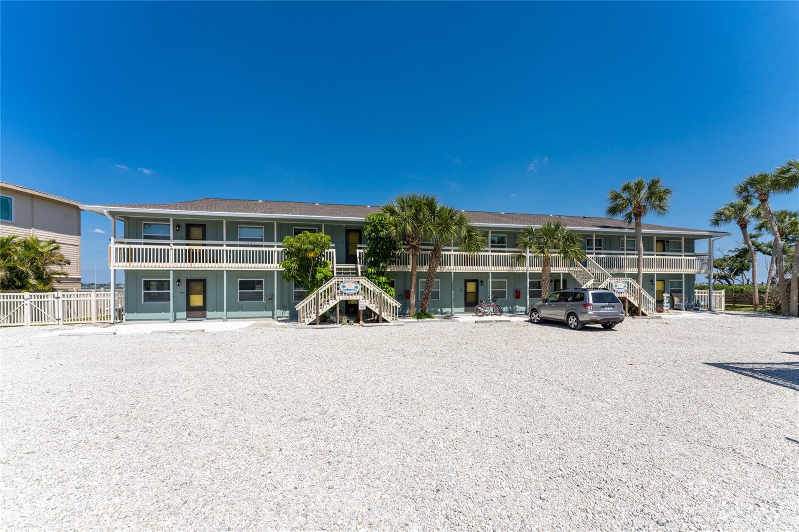 FABULOUS WATERFRONT VIEWS DIRECTLY ON LEMON BAY AND DEEDED BEACH ACCESS!! If you are a buyer searching for the ideal remedy for the winter blues or an investor seeking an income-producing property, look no further. TWO income-producing units with a strong rental history and direct access to Lemon Bay and its breathtaking sunrises are now available for the price of ONE. Upstairs, you will find Unit 3-A, a 2-bedroom, 1-bath light-filled unit with picturesque views of Lemon Bay. Unit 3-B is below and offers one bedroom (with a King bed) and one bath. Both units provide extensively updated interiors, including kitchens and baths, new coastal furnishings and decor, updated flooring, impact windows and sliders, and washers/dryers. Both units are sold turnkey furnished and are rent-ready immediately. Palm Bay is a charming 10-unit complex located within one mile, as the seagull flies, of Englewood Beach, with deeded beach access within a short walk across the street. All units showcase spectacular sunrise views over Lemon Bay, and a short walk to the beach allows one to enjoy panoramic sunset views. Shopping, restaurants, and boat rentals are readily available nearby. Please note: In addition to Units 3-A/3-B, Units 1/A-1/B (MLS#D6141045), 2/A-2/B (MLS#D6142352), and 4-A/ 4-B (MLS#D6140982) are also available and can be purchased as a package, creating the opportunity to attain majority ownership with 8 of 10 units in the complex. Call today to schedule a private showing, and be prepared to be captivated-- your truly sensational, laid-back 'Old Florida' waterfront lifestyle and your investment opportunity await.