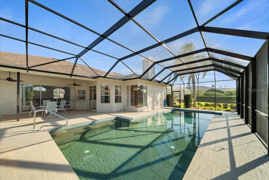Welcome to your personal slice of paradise in the heart of Peridia Golf & Country Club! This home isn't just a place to live, it's a gateway to the quintessential Florida lifestyle, meticulously cared for and thoughtfully updated. Originally crafted by renowned builder Arthur Rutenberg, this residence stands as a testament to quality design and timeless appeal.

Step inside and feel the warmth as an inviting, open floor plan draws you in, from the expansive living room to the heart of the home: a chef-inspired kitchen, now featuring a new LG refrigerator. Imagine mornings sipping coffee at the cozy breakfast nook overlooking the pool, or evenings gathered around the fireplace in the family room.

The primary suite is a true sanctuary, featuring a spacious walk-in closet and a spa-like en-suite bath with a separate shower and a deep soaking tub, perfect for unwinding. Privacy is a priority here, with a clever split-floor plan that places generous secondary bedrooms on the opposite side, ensuring a comfortable stay for family and friends.

The real showstopper is outside. Your very own tropical oasis awaits, transformed by a brand new, stunning screened lanai (a $55,800 investment!). The pool has been upgraded to a modern, low-maintenance salt system and features a new Pentair heater, filter, and pump—a true gift for anyone who loves to swim. The outdoor living space is a masterpiece, ideal for everything from lively weekend barbecues to peaceful, sun-soaked afternoons. The commitment to quality extends to every detail, from the new landscaping that creates a serene curb appeal to the updated sprinkler system and a durable Pebble-Tech garage floor.

Living in Peridia is a resort experience in itself. From the 18-hole golf course and legendary Tiki bar to a vibrant social calendar filled with community events, this is where neighbors become friends. With a brand new A/C system and updated lighting and receptacles throughout, you can move in with complete peace of mind, knowing all the major and minor updates have been taken care of.

And with beaches, shopping, and dining just minutes away, everything you need is right at your fingertips. Don't just dream of the Florida lifestyle, live it. Your new life at 4321 Presidential Ave E is waiting for you.