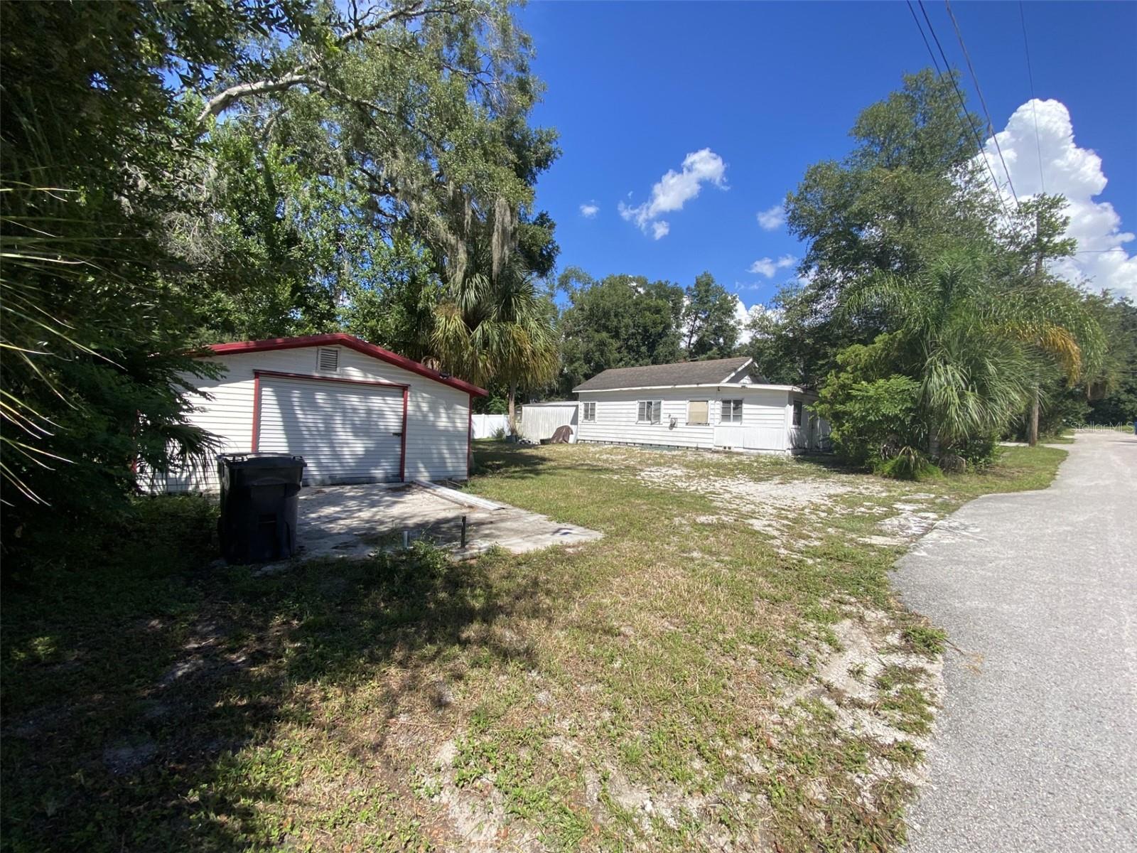 Conveniently located minutes from I-4 and I-75 this property has superb potential. Zoned Rsc4 this .23-acre property allow to embrace many possibilities. With electric, water and plumbing connected take advantage of the opportunity presented. This NO HOA RSC-4 Zoning permits the ability to add a second home on the property, allowing you to have the primary home as well as a 900 Sqft second livable dwelling as well as a large Workshop. There is currently a 20' x 60' Workshop. Schedule a tour today.