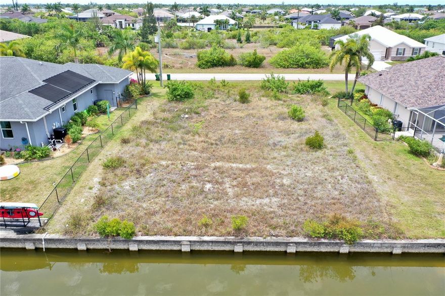 Build your Florida dream on this prime .23-acre waterfront homesite in the sought-after, deed-restricted community of South Gulf Cove. This 10,000-square-foot lot features 80 feet of road frontage and 80 feet of existing concrete seawall. Having a seawall already in place provides immense value, saving you tens of thousands in construction costs and months of permitting time while offering immediate erosion protection for your future private dock. The property sits one fixed bridge and a lock away from open water! The property is build-ready with PUBLIC WATER and SEWER available. It is NOT in a scrub jay zone and contains NO wetlands, allowing you can move forward with construction plans and environmental clearances with total confidence. There is ample room on this lot to design a sprawling floor plan alongside a custom pool overlooking the tranquil Taurus Waterway.

Ideally situated for recreation, this property is near San Domingo Park, where residents enjoy scenic nature paths and peaceful fishing spots. You are also minutes from the South Gulf Cove community park, which features a playground, basketball courts, and a public boat ramp. For commuters, I-75 is a convenient 15-minute drive, providing a direct gateway to Sarasota, Tampa, and Fort Myers. Nature lovers will appreciate being near pristine preserves with extensive hiking trails, including the Charlotte Harbor Preserve State Park.

The lifestyle here is world-class for sports and outdoor enthusiasts. You are perfectly positioned between two MLB Spring Training facilities: the Tampa Bay Rays at Charlotte Sports Park and the Atlanta Braves at CoolToday Park. Golfers will find paradise with championship courses like Riverwood and the Rotonda West courses all within a 15-to-20-minute radius. When the Gulf calls, you are only 20 minutes from the legendary beaches of Boca Grande and 25 minutes from Englewood Beach. Best of all, your backyard is the starting point for some of the best fishing in the world; enjoy immediate access to elite flats fishing for snook or venture to the Boca Grande Pass for legendary tarpon fishing. This is a rare opportunity to secure a premier canal-front lot in a vibrant boating community.