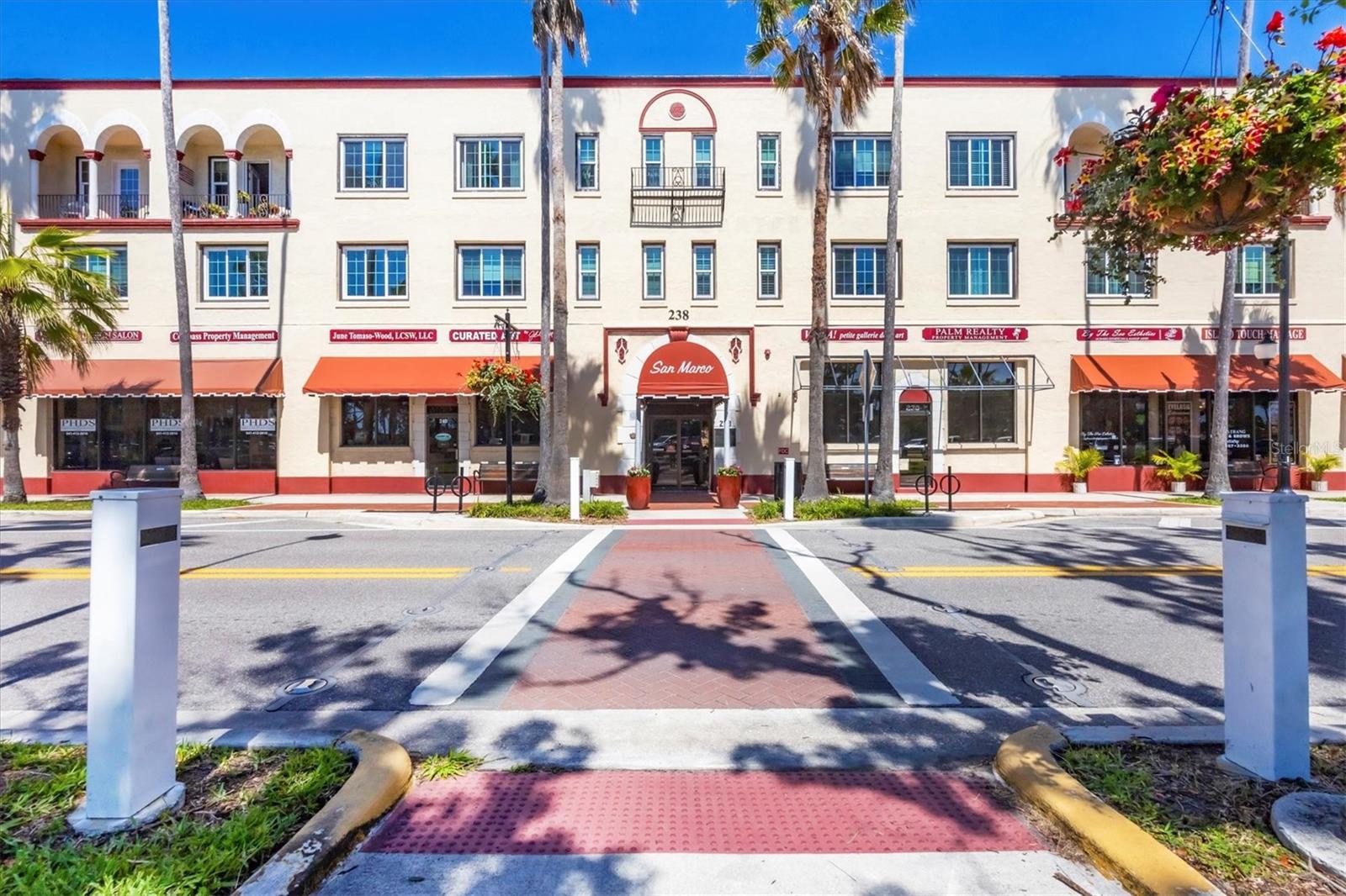 This condo offers the perfect balance of historical charm and modern living, all in one of the most desirable locations in Venice. This rarely available 2 BR, 2BA split layout condo is in the historic KMI/SAN MARCO BUILDING. As you step inside, you’ll be greeted with an abundance of natural light that streams in through the new Hurricane Impact Resistant windows. The kitchen is small, but sufficient, and has a roomy pantry. The original 1920’s Mediterranean ceiling beams add character to the open living space. The bedrooms are at separate ends of the condo. Both have large walk-in closets and ensuite bathrooms with one having a tub/shower combination, and the other one having a walk-in shower. The laundry is located on the same floor and each condo has a storage closet in the laundry room. The building has stairs at the end and center, plus an elevator in the center, so access to this second-floor unit is easy. This unique KMI BUILDING is on the National Register of Historic Landmarks in the U.S. Enjoy the coastal lifestyle in this well cared for historic building with so much local history. Downstairs you’ll find shops, a restaurant, hair salon, and a wine bar. This fabulous location is directly across from Centennial Park and provides convenient island living to all the Venice activities such as the Venice Farmers’ Market, art festivals, gazebo concerts, and a diverse selection of restaurants and shopping at your front door. You cannot beat this location! Park your car and walk to all the Island has to offer! Less than 1 mile to Venice Beach, plus close to the Legacy Trail and the Venetian Waterway Park for miles of walking, running, and biking options. This condo complex offers private parking in the back and designated locked bike area! The building has a 7-year-old roof, elevators, and interior closet storage. The clubhouse is large and can be used for private events. It features a pool table and piano for entertainment. The beautiful heated pool can be enjoyed all year, along with the seating areas around it. Whether a seasonal get-a-away, full time home, or an investment, don’t miss the opportunity to own a piece of history in this fantastic building.