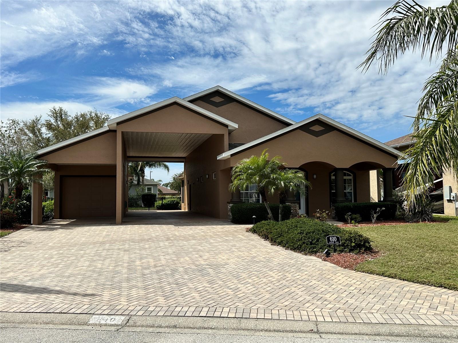 This home in the sought after community of Mt Olive Shores North is move in ready. It was completely remodeled in 2021 and recently received a brand new roof and fresh exterior paint along with a new A/C unit and hot water heater. All major appliances are new and ready to just move in. The home offers 2 bedrooms and 2 bathrooms. A very spacious living room area and a separate breakfast nook for your morning coffee. Both the dining area and primary bedroom have access to the very private covered enclosed lanai. The backyard is already fenced in for your furry family member. The garage is a single car but extra long. The RV port measures approximately 16' x 60' with a sun screen at one end and also includes a carport for that extra vehicle. This property is priced to sell so call today for an appointment to see this wonderful property.
