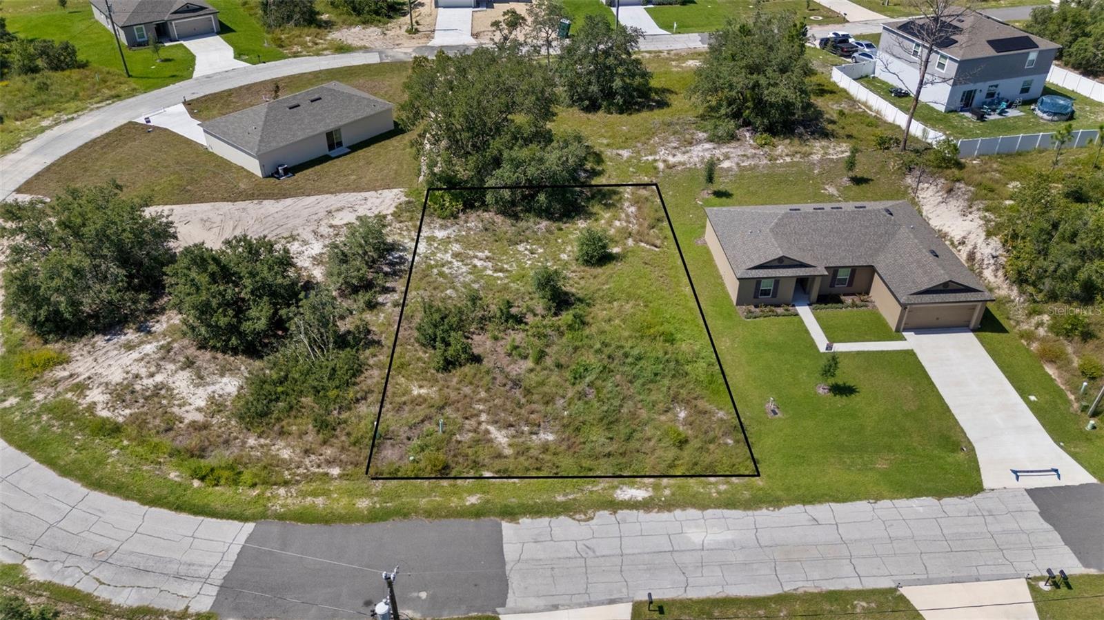 The seller owns 12 lots in Poinciana, several on the same street, which can be PURCHASED IN BULK, presenting a rare opportunity for builders or investors to secure multiple parcels at once at a discounted rate. MLS Numbers: O6335500, O6335683, O6335689, O6335698, O6335703, O6335706, O6335716, O6335719, O6335726, O6335730, O6335755. This lot at 416 Caribbean features minimal large trees, providing a canvas ready for your next project. With utilities recently added to this street, it has seen a boom in new home construction over the last year. The low HOA fee includes access to the Poinciana Victory Pool, Aquatic Center with 8 lap lanes, and the APV Community Center featuring event rooms, an amphitheater, a fitness center, and expansive outdoor recreation with sports fields, basketball courts, playgrounds, picnic areas, and walking trails. High-speed internet (300 Mbps) and cable TV (250+ channels) are also included. The lot is conveniently located near shopping centers and restaurants. It’s a short drive to Disney, SeaWorld, Universal Studios, Legoland, and Orlando International Airport, offering both lifestyle and convenience. This lot is perfect for new construction or long-term investment. With low HOA fees, abundant amenities, and strong area growth, these Poinciana lots provide unmatched opportunity for builders, investors, or future homeowners.