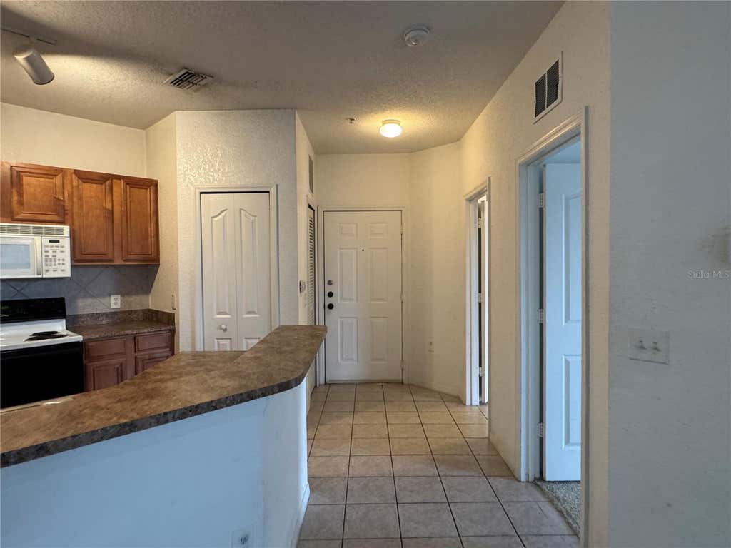 Photo of 6149 Metrowest Boulevard #208, Orlando, FL 32835 (MLS # O6414662)