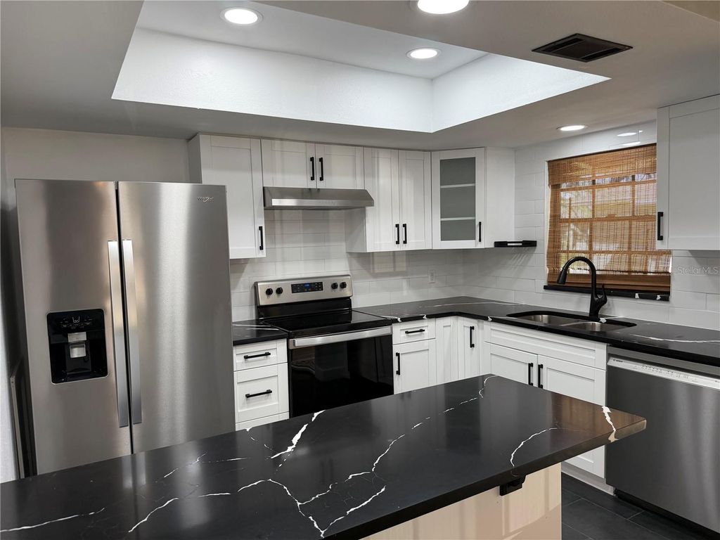 Photo of 4015 Ashford Green Place #D201, Tampa, FL 33613 (MLS # TB8485606)