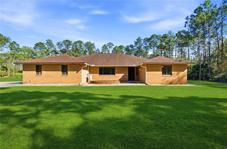 Custom-built in 1992 and only ever owned by one family since day one, this 2,340 sq ft brick home sits on 6.48 private acres. The home is surrounded by trees on all sides, creating an ultra-private property, and is zoned for horses. Inside, there are 3 bedrooms, 2 baths, an office, and a bonus room. 

The home, although outdated in appearance, has been very well taken care of. The home was inspected before listing to ensure that the new owner could come in and renovate to their heart's content without worrying much about extra, non-cosmetic work. Inspection is available upon request. Recent updates include an updated electrical system, brand-new skylights, and a repaired roof. 

The home is about 10-15 minutes away from the beach, and 20 minutes from Daytona International Speedway.

This is a rare opportunity to own a well-cared-for, single-owner home on acreage in quiet Eagle Rock, Ormond Beach.