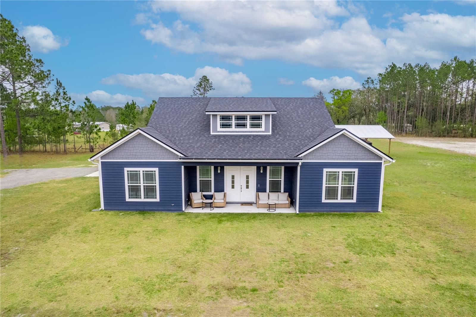 Experience modern elegance on 2 acres in the very sought after Union County. This 2022 - built home features cathedral ceilings, an open concept living room , dining room, and kitchen. Granite counter tops throughout, Jack & Jill bathroom, half bath, walk in closet in the master, three bedrooms, 2 full baths, and an added bonus of a two car carport. Outside you'll find an in ground pool and a spacious 32x48 pole barn with endless possibilities. Welcome to your DREAM HOME! Schedule your showing today.