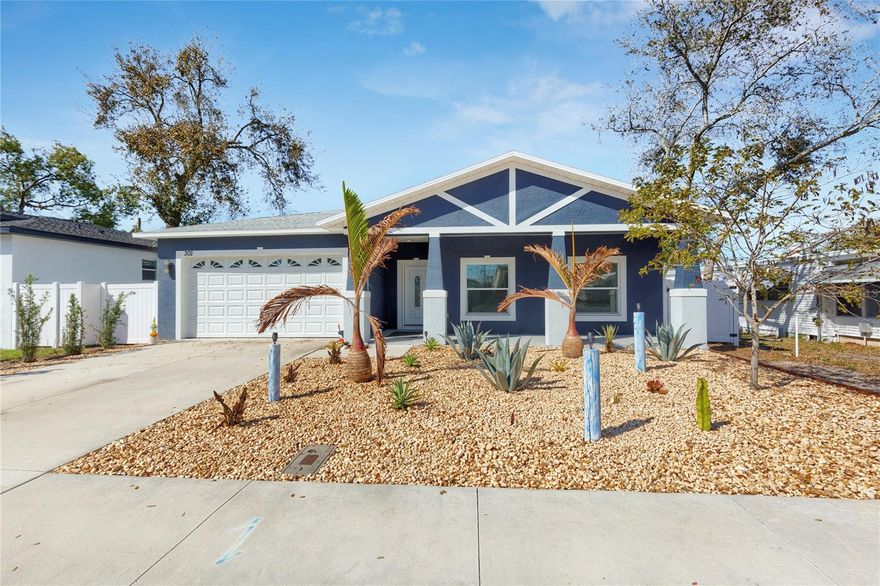 NEW, NEW, NEW! Built in 2023, this stunning home is truly move-in ready. Light-filled and beautifully designed, this 3-bedroom, 2-bath residence offers a bright, open, and airy layout perfect for modern living. The gorgeous kitchen features a large center island, abundant cabinetry, and sleek stainless steel appliances ideal for both everyday living and entertaining. The spacious living and dining area flows seamlessly together, highlighted by a visually striking fireplace and immaculate tile flooring throughout, all complemented by a timeless neutral color palette. Both bathrooms are generously sized and appointed with elegant white marble-look tile for a clean, sophisticated finish. The oversized two-car garage conveniently includes the washer and dryer. Step outside to the breezy covered rear patio overlooking a fully fenced backyard with attractive xeriscape, low-maintenance landscaping perfect for enjoying Florida living year-round. Ideally located in charming Dunedin, Florida a renowned golf cart-friendly community!  Cart to Downtown Dunedin's Main Street and enjoy the many restaurants, breweries, shops, marinas, markets, festivals and events!  Minutes to the world-famous Clearwater Beach, Honeymoon Island and Pinellas Trail.