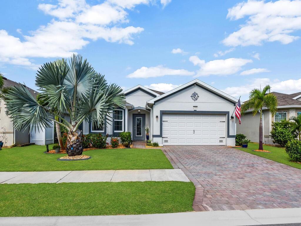 Enjoy serene lakefront living in this beautifully maintained single-family home, featuring an expansive extended lanai with Sunbelt curtains for privacy and sun protection. Inside, the spacious eat-in kitchen is designed for both style and function, with dual-color shaker cabinets, granite countertops, custom pull-out drawers, a coffee station, and stainless steel appliances—including a new refrigerator installed in 2024—plus abundant counter space for cooking and entertaining. The tranquil primary suite offers stunning lake views and an updated en suite bathroom with dual sinks, quartz counters, a walk-in shower, a separate water closet, and a large walk-in closet. Thoughtful design touches throughout the home include a shiplap accent wall in the primary bedroom, batten board storage accents in the living area, wainscoting in the guest bathroom, and crown molding throughout the living spaces and kitchen. Additional features include an updated laundry room with full-size stackable washer and dryer (2024), extra storage, and a barn door. Durable luxury vinyl plank flooring flows through the living areas, kitchen, entry, and laundry, while tile enhances the bedrooms and bathrooms. A whole-house water filtration system ensures clean, refreshing water throughout. Outside, the freshly painted exterior frames a fully fenced yard with meticulously maintained landscaping, a lush Zoysia lawn, concrete curbing, and an irrigation system. A generator hookup adds convenience and peace of mind. This home combines thoughtful updates, elegant finishes, and a prime lakefront setting—perfectly designed for buyers seeking comfort, style, and everyday enjoyment.