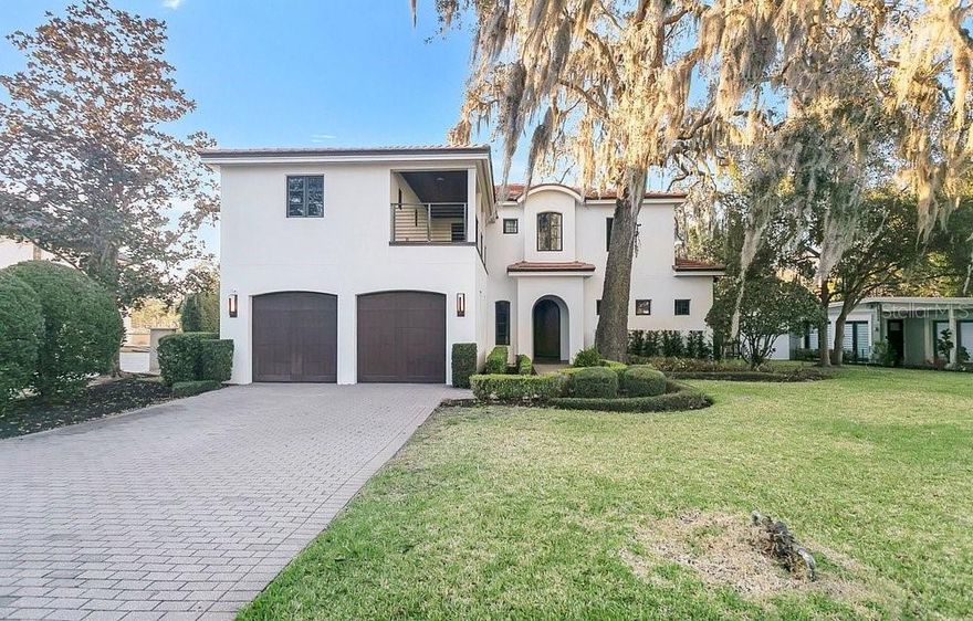 A rare Winter Park Canal, Chain of Lakes, water view custom home-where art, architecture, and waterfront living converge. Step into your
future with this extraordinary custom built residence, inspired by the artistic richness of Fernando Botero. From your back lanai, step directly
onto your private, custom boat dock featuring a covered, remote-operated boat lift, and cruise the Venetian Canal with direct access to Winter
Park’s exclusive Chain of Lakes-Lake Virginia, Lake Mizell, Lake Osceola, Lake Maitland, Lake Nina, and Lake Minnehaha. Morning sunrises and golden afternoon sunsets create unforgettable moments to enjoy privately or share with family and friends. Built in 2008, this exceptional home welcomes you with a stunning rotunda accented by stained glass panels, setting the tone for the refined design found throughout. Vaulted recessed ceilings enhance the open floor plan, filling the home with natural light and architectural elegance. Thoughtfully curated details and custom finishes are showcased in every space. Offering approximately 5,051 square feet, the home features four spacious bedrooms, each with its own en suite bathroom. The owner’s suite is a private retreat with picturesque canal views and luxurious built-in features. The spa-inspired owner’s bath includes dual vanities, designer textiles, strategic lighting, expansive walk-in closets, a steam shower with dual stations and multiple shower heads, a Jacuzzi tub, bidet, linen storage,and a private water closet. 
Designed for effortless entertaining, the gourmet chef’s kitchen is both functional and beautiful. Highlights include an oversized working island, high-top bar seating,Thermador gas range,Thermadore double ovens,Thermadore refrigerator, wine cooler, hidden lighted walk-in pantry and multiple prep areas. The kitchen flows seamlessly into the formal dining room and the expansive great room, which showcases floor-to-ceiling views of the lushly landscaped backyard, paver patio and serene Venetian Canal water view. A stunning library with floor-to-ceiling canal views features a custom gas fireplace and built-in shelving, perfect for displaying books and treasured collections. The first floor features a convenient half bath adjacent to the laundry room, along with a lovely powder room ideal for guests.  Upstairs, a striking staircase leads to three additional bedrooms and two bathrooms. One bedroom room has a private en-suite bathroom and the other bedrooms share an adjoining en- suite bath. There are two oversized, versatile gathering spaces complete with a built-in wet bar and beverage refrigerator. A spacious living area overlooks the canal and opens to an upper-level lanai-ideal for outdoor entertaining. This level also includes a home theater and flexible space suitable for an additional bedroom, office, or recreation room. 
Location is unmatched. Situated in the heart of Winter Park, this home offers easy access to both Winter Park and Maitland amenities. Enjoy Park Avenue dining, shopping, art festivals, farmers markets, outdoor concerts, scenic walking and biking trails, and beautiful green spaces. Zoned for top rated OCPS schools: Dommerich Elementary, Maitland Middle School, and Winter Park High School. This remarkable Winter Park Canal home combines timeless style, exceptional craftsmanship, private dock access, Venetian Canal frontage, and direct connection to the Winter Park Chain of Lakes-all in one of Central Florida’s most sought-after locations.