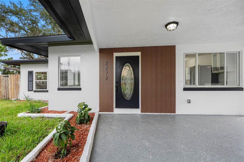 Photo of 2413 Baywood Drive E, Dunedin, FL 34698 (MLS # TB8411389)