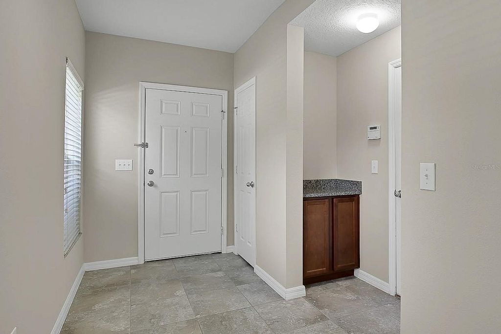 Photo of 16016 Persimmon Grove Drive, Lithia, FL 33547 (MLS # TB8390650)