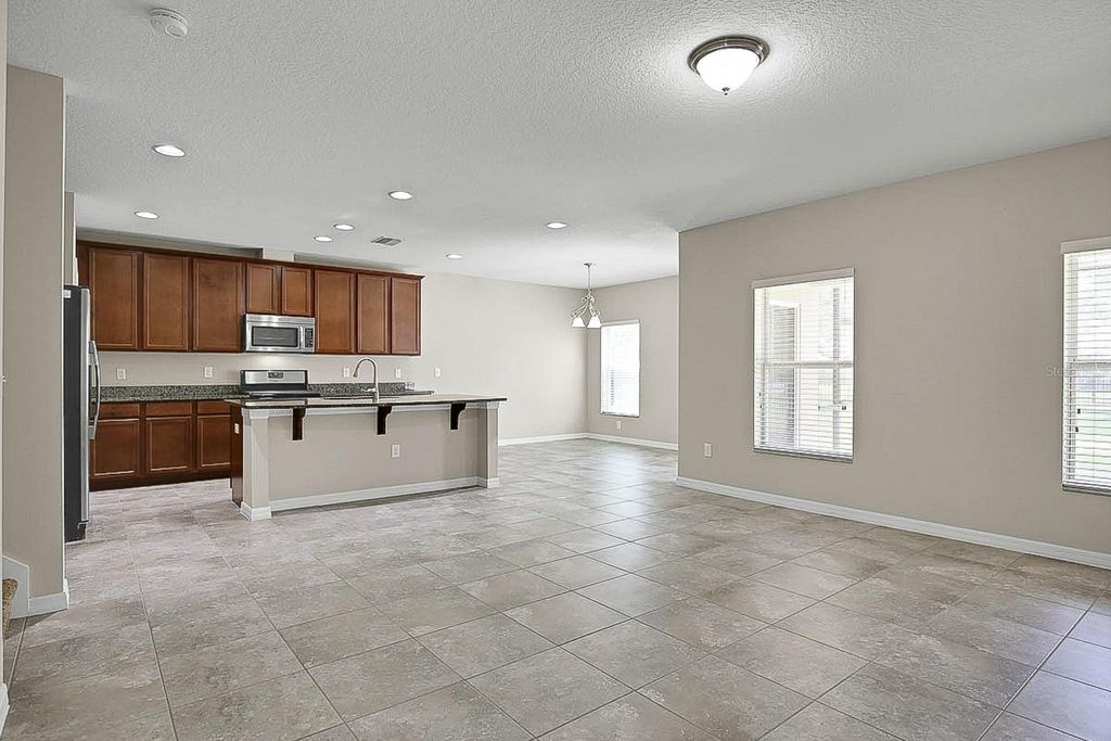 Photo of 16016 Persimmon Grove Drive, Lithia, FL 33547 (MLS # TB8390650)