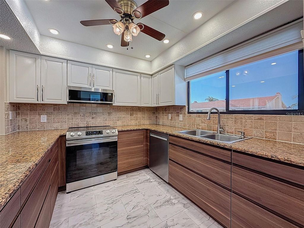 Photo of 9981 Eagles Point Circle #4, Port Richey, FL 34668 (MLS # TB8495093)