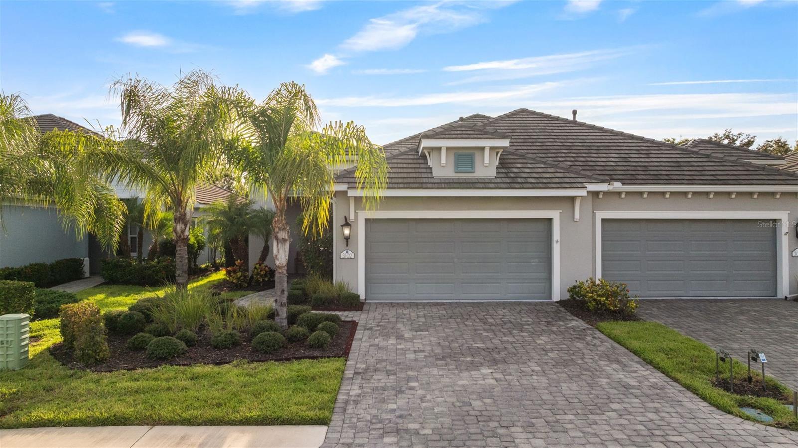 Florida living at its finest! This maintenance-free villa in Indigo’s resort-style community is loaded with high-end upgrades and designed for both comfort and style. Offering 3 bedrooms, 2 baths, and an office/flex space, the split floor plan separates the primary suite from the secondary bedrooms—perfect for privacy. Two bedrooms sit at the front of the home with a shared bath, while the primary suite is tucked at the back overlooking serene conservation and water views with no rear neighbors.
The kitchen is a showstopper with high-end finishes: quartz counters, tile backsplash, soft-close cabinetry with crown molding, an upgraded stainless faucet, and a gas range. The kitchen flows seamlessly into the dining and living area, where a tray ceiling with crown molding. There are sliders from the family room which open to the extended lanai—ideal for relaxing evenings or entertaining with a view.
The private primary suite is a retreat of its own, featuring dual walk-in closets, double vanities, and a large tiled walk-in shower. Throughout the home, you’ll find engineered hardwood and tile flooring, designer light fixtures, 8-foot doors, and upgraded cabinet hardware. The laundry room adds extra function with base cabinets, Corian counters, and a utility sink. For added peace of mind, the home features storm-rated impact windows and doors, complemented by roll-down hurricane shutters on the lanai and full-home gutters.
Indigo offers a true resort-style lifestyle, with exclusive access to The Oasis Pool, reserved only for villa owners, along with the main clubhouse pool, heated spa, and a full suite of world-class amenities. Residents enjoy a 24-hour fitness center, pickleball and bocce ball courts, a social clubhouse, and a full-time lifestyle director who curates year-round activities and events. With maintenance-free living, lawn care and landscaping are handled for you—leaving more time to enjoy all that Lakewood Ranch and the Gulf Coast have to offer.
Conveniently located near top-rated schools, Waterside Place, University Town Center, premier shopping and dining, and world-renowned beaches including Siesta Key, Lido Key, and Anna Maria Island, this move-in-ready villa presents a rare opportunity for luxury and convenience in one of Florida’s most desirable communities. Schedule your private tour today and embrace the Indigo lifestyle!