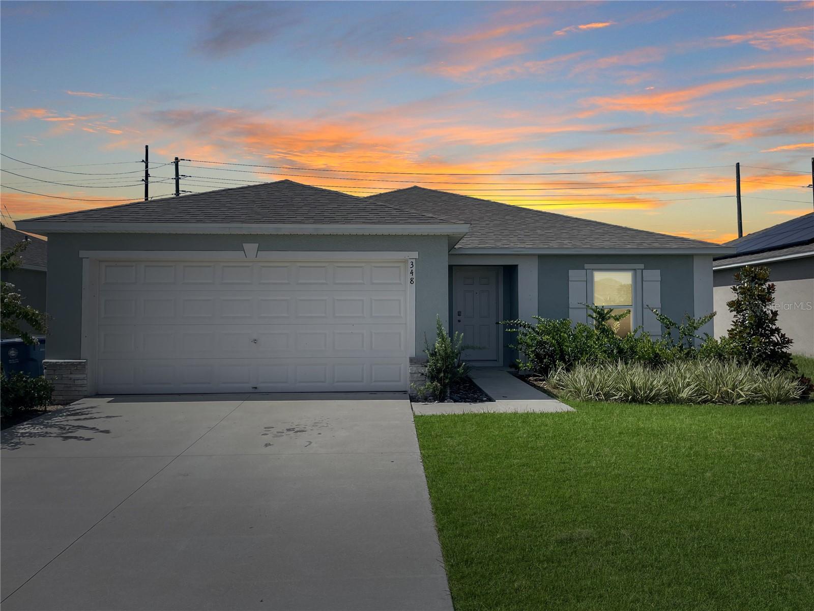 Welcome to the TRANQUIL COMMUNITY of Alford Oaks. This beautifully designed 4-bedroom, 2-bathroom home offers both personal PRIVACY, with its thoughtful SPLIT-BEDROOM LAYOUT, and inviting SPACES FOR ENTERTAINING, thanks to an OPEN-CONCEPT LIVING AREA. Upon entering, you’re greeted by a TILED FOYER that leads seamlessly into the heart of the home down a WIDE HALLWAY. The first stop on your right is a GUEST BEDROOM at the front of the house, featuring a charming view of the lushly LANDSCAPED FLOWER BED. A little further down the hall to the left, you’ll find a SPACIOUS LAUNDRY ROOM with convenient access to the TWO-CAR GARAGE, complete with DURABLE POLYASPARTIC FLOORING. At the end of the hall, the space opens up to reveal an EXPANSIVE DINING and LIVING ROOM that blend effortlessly, creating the perfect setting for gatherings and everyday living. To the right are TWO ADDITIONAL SIZABLE BEDROOMS, separated by a LINEN CLOSET and a BATHROOM appointed with GRANITE COUNTERTOPS and a SHOWER/TUB combination. To the left of the dining area, you’ll discover the LARGE PRIMARY SUITE, which offers an ENSUITE BATHROOM featuring a GRANITE-TOPPED VANITY with a DEDICATED BEAUTY STATION—ideal for your morning routine—as well as a WALK-IN SHOWER and a GENEROUS WALK-IN CLOSET. Behind the living room, the OPEN KITCHEN is thoughtfully designed with GRANITE COUNTERTOPS, stylish GREY CABINETRY, a PANTRY, and STAINLESS STEEL APPLIANCES. The layout provides AMPLE COUNTER SPACE for meal preparation and casual dining, making it EASY TO ENTERTAIN GUESTS or enjoy family meals together. Through the SLIDING GLASS DOORS, you’ll find a WELL-MAINTAINED, SPACIOUS BACKYARD that is PARTIALLY FENCED, offering both OPENNESS and PRIVACY. This home is CONVENIENTLY LOCATED just around the corner from a BRAND NEW Publix shopping plaza and ONLY MINUTES from US-27 and 17-92, providing EASY ACCESS to theme parks, dining, medical facilities, and shopping destinations. COME EXPERIENCE this beautifully planned home and explore all the wonderful amenities the surrounding area has to offer.