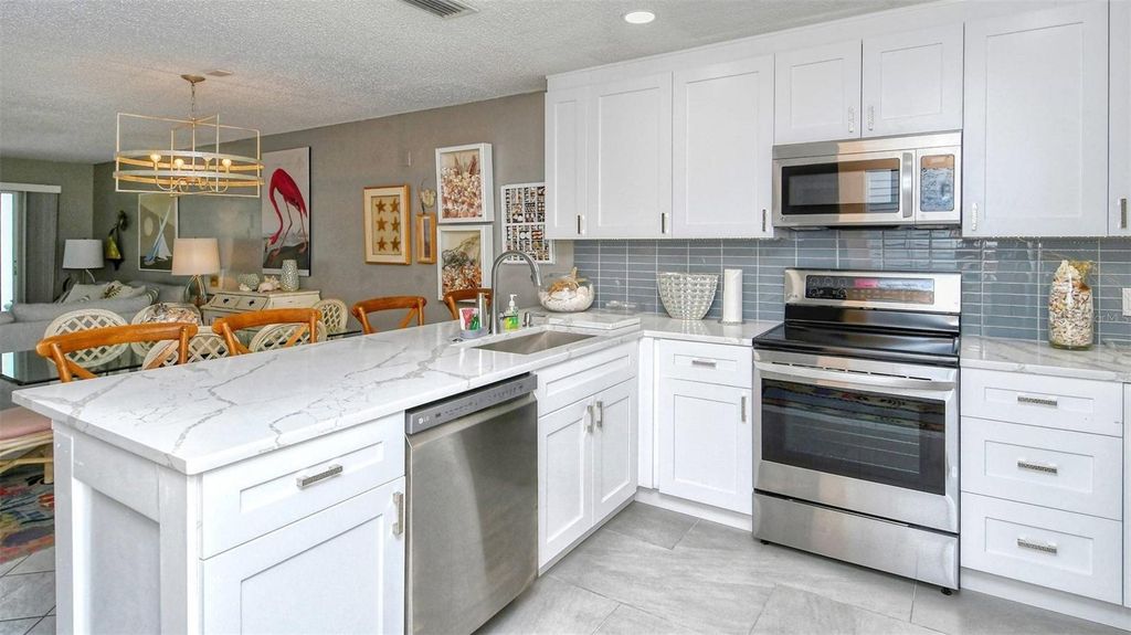 Photo of 1255 E Peppertree Drive #101, Sarasota, FL 34242 (MLS # TB8470461)