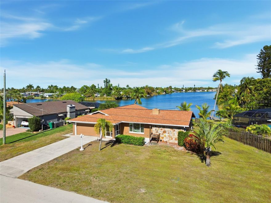 Enchanting lakefront home in Fort Myers, where thoughtful updates, serene views, and timeless character come together beautifully. Sparkling lake views and surrounded by peaceful wildlife, this home offers a tranquil Florida lifestyle you’ll fall in love with the moment you arrive. The heart of the home is the beautifully designed kitchen, perfectly planned for both everyday living and entertaining. It features top-of-the-line Bosch appliances, a wall oven and microwave, a large warming drawer, abundant cabinetry with convenient pull out storage, a hallway pantry, and a charming sink set beneath a window overlooking the lake. The inviting layout offers multiple living and dining spaces, including a main living room highlighted by a striking rock and slate fireplace that can be enjoyed as wood-burning or electric. Two dining areas and a comfortable family room provide plenty of space for gatherings or quiet evenings at home. Custom painted ceilings throughout add warmth, charm, and a unique sense of character you won’t find in just any home. The split bedroom floor plan offers privacy and comfort, featuring a spacious primary suite with an ensuite bath, while the guest bedrooms include walk-in closets and share an updated bathroom with a shower and a convenient door leading directly to the lanai. Step outside to the expansive lanai and soak in the peaceful setting, long lake views, and visiting birds and wildlife, your own private retreat for morning coffee, sunset dinners, or relaxing afternoons. A backyard shed provides extra storage, and the two-car garage includes a full-size washer and dryer plus a utility sink for added convenience. Additional upgrades include impact-resistant windows and sliding doors, an updated front door, a 2020 roof, water filtration for the house, insulated attic, and updated air ducts. This special lakefront home blends charm, quality, and serenity into one exceptional opportunity.