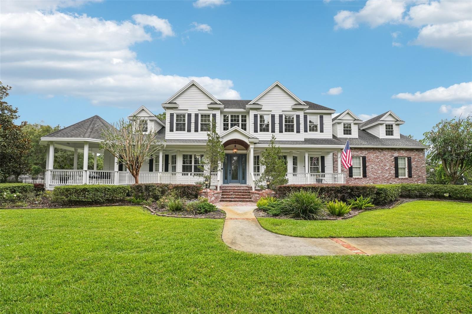 Luxurious Estate Living in a Coveted Neighborhood ~ Discover unparalleled comfort and elegance in this stunning 7-bedroom, 6.5-bathroom single-family estate, set on just under 2 PRIVATE, fenced acres. Recently UPDATED IN 2024 with a PROFESSIONAL DESIGNER, this home blends timeless charm with modern luxury. Step inside to find expansive living spaces, including a FULLY FINISHED BASEMENT featuring a state-of-the-art home theater, gaming area, and a dedicated exercise room. The heart of the home boasts a GOURMET KITCHEN, while the exterior is an entertainer's dream: a RESORT-STYLE POOL, full OUTDOOR KITCHEN with CABANA, and a wraparound porch perfect for relaxing or entertaining year-round. A SEPARATE GUEST HOUSE offers a full kitchen, bathroom, and washer/dryer - ideal for extended family, guests, or a private office suite. Additional features include a 4-car garage and a location in one of the area's most sought-after neighborhoods, just minutes from shopping, dining, and top amenities. This home is luxury redefined-inside and out! Some of the added features are: RECLAIMED GEORGIA BARNWOOD, NEW WATER SOFTENER, NEW SUMP PUMPS, NEW FRONT DOOR, NEW POOL PUMP, HEATER & LIGHTS, NEW LANDSCAPING, WHOLE HOUSE GENERATOR, CONTROL 4 SMART HOME SYSTEM & FRESHLY PAINTED INSIDE & OUT. Call today for your exclusive showing!