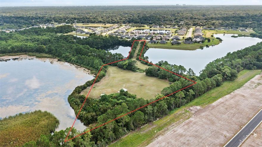 OWNERS MUST SELL and willing to consider all reasonable offers.  A Rare Opportunity to Own One of Flagler County’s Most Stunning Homesites – 38 Eagle Lake Dr Introducing 38 Eagle Lake Dr—a truly exceptional 5.6-acre estate lot that offers the rare combination of privacy, natural beauty, and build-ready convenience. Nestled at the very back of the serene Eagle Lakes subdivision and surrounded on three sides by expansive lakes, this parcel offers the feeling of a private island retreat while remaining minutes from town. The current owner has gone above and beyond by bringing in substantial fill dirt to elevate the homesite, ensuring it is high, dry, and entirely located in Flood Zone X. With the driveway and building pad already cleared, this property is ready for your dream home. Whether you envision a sprawling custom estate, a luxury lakefront retreat, or simply a peaceful place to enjoy the outdoors, the possibilities here are endless. Living in Eagle Lakes means embracing a slower, more intentional lifestyle while remaining close to all the conveniences of Palm Coast and Flagler Beach. Just 10 minutes to the beach and major shopping plazas, and only 5 minutes to grocery stores and I-95, this location perfectly balances rural tranquility with coastal accessibility. You'll enjoy quiet mornings with water views, evenings under starry skies, and the unique charm of Flagler Beach—a vibrant, artistic, and welcoming coastal town known for its laid-back atmosphere and strong sense of community. An added bonus: this property falls under Flagler County jurisdiction, where the millage rate is just 14.13, a significant savings compared to the 19.58 rate in the city of Flagler Beach. That means lower impact fees and long-term tax benefits—an ideal scenario for savvy buyers looking to build without unnecessary overhead. Properties like this simply don’t come along often. Don’t miss your chance to own one of the most picturesque and build-ready parcels in the area. Call today to schedule your private tour of 38 Eagle Lake Dr and discover the lifestyle you’ve been dreaming of.