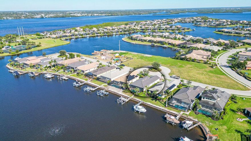 Welcome to Your Secure Boater’s Paradise! Nestled along a serene private lagoon in the gated community of Tidewater Preserve, this stunning Florencia Model home delivers breathtaking waterfront views and an effortless, upscale lifestyle for those seeking the ultimate in coastal luxury. At 3 bedrooms, 2 full baths, a versatile den, and 2,039 sq ft of thoughtfully designed space, it blends elegance with practical sophistication, including a heated saltwater pool that's perfect for year-round relaxation or entertaining. Step outside to your private Trex dock, custom-built to accommodate up to a 30’ power cruiser, complete with one of the lagoon's highest-capacity 16,000-lb lifts for hassle-free boating. Cruise to the Manatee River and Gulf of Mexico via the community's efficient 2-lock lift system. This setup is a seamless blend of convenience with immediate waterfront access. Engineered for ultimate peace of mind, this home features top-tier storm protection: easy-to-deploy RollShield hurricane shutters, a motorized Kevlar screen safeguarding the lanai, bedroom doors, and sliders, plus impact-rated features throughout. Every inch has been meticulously maintained for effortless ownership—dual AC units professionally serviced, a recently pressure-washed and sealed roof (under warranty), pristine lanai, pool deck, and walkway to the dock—all backed by transferable warranties to ensure lasting reliability. Inside, the open-concept design floods every room with natural light and panoramic west-facing lagoon views, where jaw-dropping sunsets paint the sky. Embrace the coastal-inspired motif with beachy elegance: soaring 10’-12’ ceilings, granite countertops galore, and a chef's dream kitchen featuring stainless steel appliances, a grand center island, and upgraded cabinetry for effortless meal prep or gatherings. Unwind in the spacious primary suite, your private oasis with a relaxing garden tub and luxurious walk-in shower. Smart modern touches abound, like natural gas hookups, an efficient tankless water heater, convenient wood-laid attic storage, and an in-wall pest control system—details that deliver daily convenience and delight.Tidewater Preserve elevates everyday living with resort-level amenities designed for vibrant, active lifestyles. Boating fans rejoice: the private marina offers available slips and lifts for instant access to the Manatee River and beyond. Unwind at the recently remodeled Lodge clubhouse, boasting a resort-style pool with stunning river views, a state-of-the-art fitness center, spacious community kitchen, flat-screen TVs, and cozy gas fireplaces—both indoors and out—for ultimate comfort. Fire up the outdoor grill poolside for casual barbecues, or stay active on three pristine Har-Tru tennis courts. Water sports enthusiasts will love the canoeing and kayaking options, with reservable storage racks available for a nominal fee. Security is seamless with a 24/7 staffed gatehouse, while a full-time lifestyle activities director keeps the calendar buzzing. Furry family members get their own large, fenced dog park, and nature lovers can stroll the scenic preserve trail to a tranquil seating area—ideal for soaking in year-round sunrises and sunsets. Tidewater is truly maintenance-free: expert landscaping and lawn care are included in the HOA, so you can focus on what matters—making memories. Just minutes from the powdery white sands of Anna Maria Island for beach days, and the upscale shopping and dining at UTC Mall.
