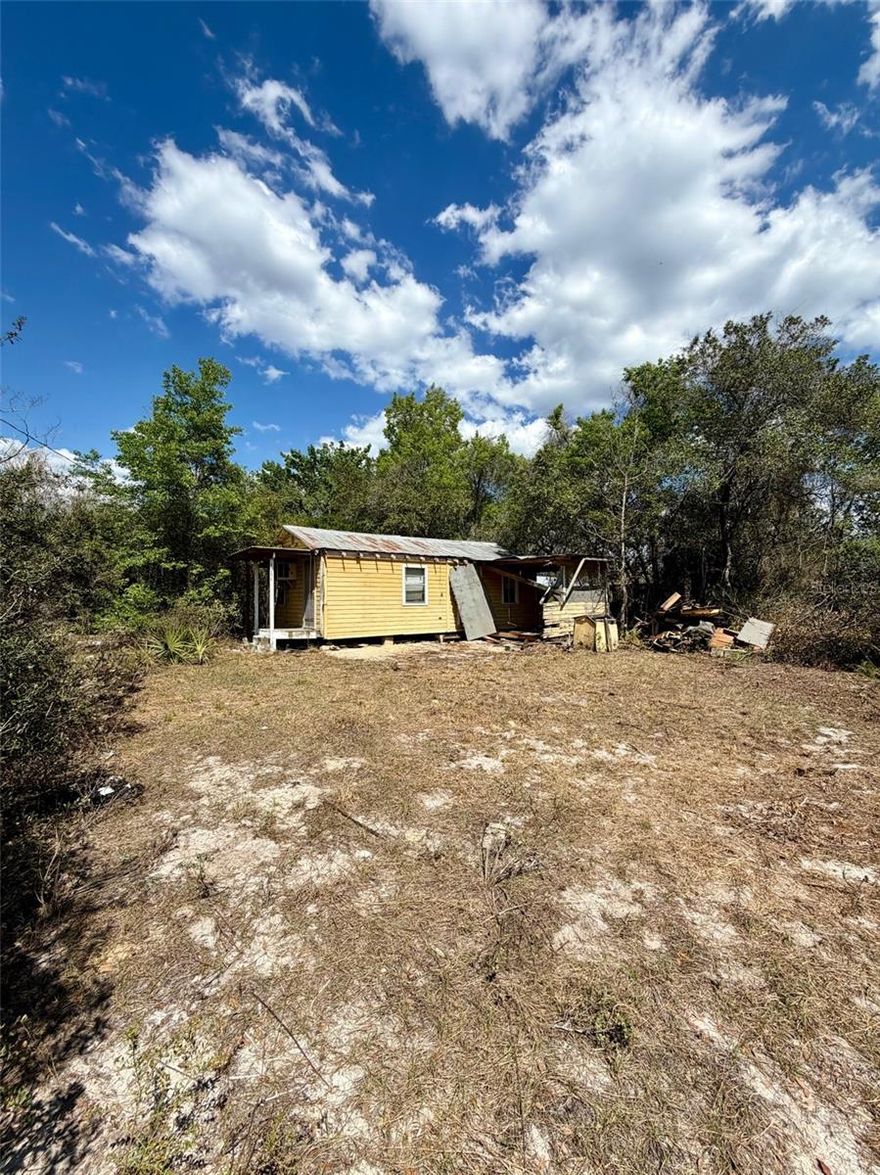 In the heart of the Ocala national Forest and short dirt road ride to access the OHV(Off Highway Vehicle) trails. This home needs lots of work or start over with new site built or manufactured home. Located 10 minutes from downtown Fort McCoy with a grocery store, doctor's office, pharmacy, hardware, gas station, pizza, and more. Short drive to Silver Springs which includes Walmart, Lowes, Bealls, Outback and many more of your favorite shopping spots and restaurants. Ocala is only another 10 minutes from Silver Springs with vibrant night life and lots of entertainment options and restaurants. Gainesville(Home of Florida Gators) is only 50 minutes to downtown. If you’re a fisherman, or hunter or simply love hiking, canoeing or kayaking you are in luck! Minutes to Ocklawaha River, Ocala National Forest, and many natural springs(Salt Springs, Silver Glen Springs, Juniper Springs), horseback and walking trails, and off-road vehicle trails await your explorations. One-of-a-kind property and location! Ready for new owners!