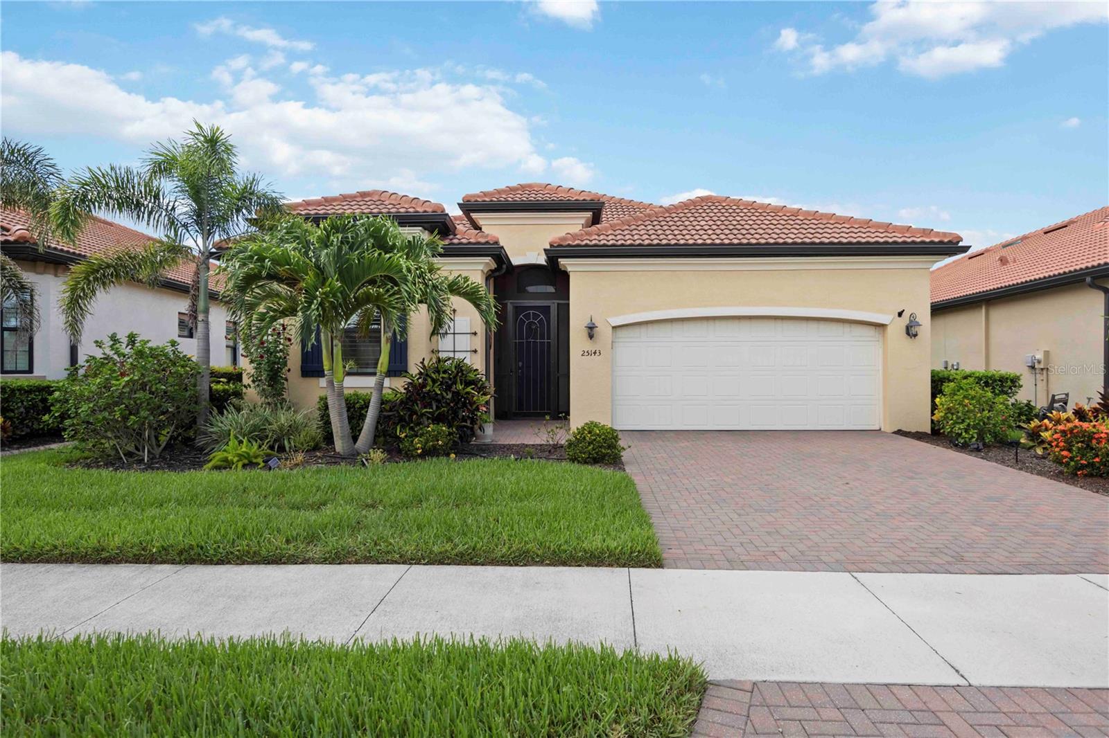 One or more photo(s) has been virtually staged. Enjoy the Luxury Golf Lifestyle.
Welcome to this stunning Maria model home, where luxury, comfort, and resort-style living converge in the sought-after, gated golf community of Sarasota National. This impeccably maintained 4-bedroom, 3-bath pool home includes two golf memberships with no initiation fees, offering effortless access to championship play and unparalleled amenities.
Step through the elegant foyer into an open-concept design that showcases a tranquil water view, tray ceilings, crown molding, 8-foot doors, and diagonal-set porcelain tile throughout the main living areas. The heart of the home is a chef-inspired kitchen featuring white cabinetry, quartz countertops, under-cabinet lighting, a tile backsplash, walk-in pantry, stainless steel appliances including a wall oven and glass cooktop, and a large island with seating for four. Custom pull-out shelving in every lower cabinet adds thoughtful function to this stylish space.
The spacious living and dining areas are bathed in natural light from triple sliding glass doors, leading to a screened lanai where you’ll enjoy breathtaking sunsets, peaceful evenings, and a sparkling saltwater pool and spa. A 22-foot motorized, lighted retractable awning offers shade at the touch of a button. For added peace of mind, the home features impact windows, a Storm Catcher motorized hurricane screen, and a Duromax 10 hour generator.
The owner’s suite is a serene retreat with dual closets (including a large walk-in), a spa-style bathroom with dual vanities, and a large walk-in shower. A private sliding glass door provides direct lanai access. Three additional guest bedrooms are positioned for privacy—one with an en-suite bath—perfect for visitors or multigenerational living. The well-equipped laundry room includes a utility sink and extra cabinetry, and the epoxy-finished 2-car garage offers overhead storage.
Additional upgrades include plantation shutters, designer lighting, and enhanced lanai lighting, and the home is offered partially furnished.
Sarasota National offers an unmatched amenity-rich lifestyle, including a 30,000 sq. ft. clubhouse with fine dining, coffee lounge, resort-style pool, tiki bar, full service spa, a 7,000 sq. ft. fitness center, tennis, pickleball, bocce, dog park, playground, and more—all surrounded by 2,400 acres of pristine wetlands and lakes.
Minutes from Wellen Park, CoolToday Park, beaches, downtown Venice, shopping, and dining—this home is the perfect blend of luxury, location, and lifestyle. Don’t miss your chance to make it yours. Schedule your private showing today.