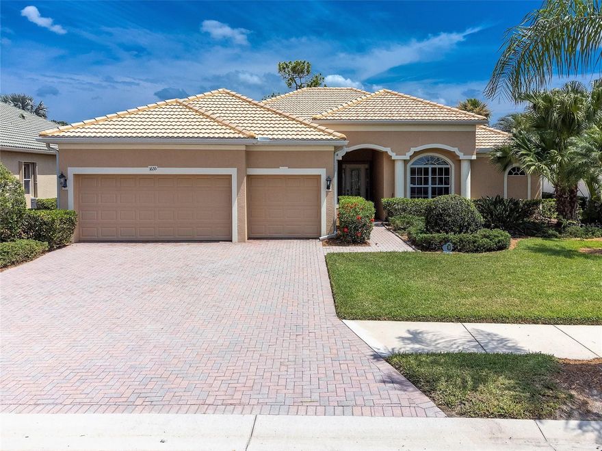 Located in the highly sought-after Heron Creek Golf and Country Club. This beautifully maintained TURNKEY READY executive pool home boasts 2,771 square feet of living space and features a desirable split floor plan providing perfect spaces for all including a family room, formal living/dining room, 3 bedrooms plus office/den and 3 full baths all connected to the beautiful outdoor area that makes this perfect for living out your Florida dream lifestyle. The moment you arrive at this elegant home you will begin to appreciate the upgrades from the 3-car garage, tiled roof, lush tropical landscape, and paver driveway.  Other noteworthy features include porcelain tile on the diagonal, crown molding, tray ceilings, designer lighting, plantation shutters, a water filtration system and a soothing color pallet that compliments all the furnishings.  The gourmet kitchen showcases a suite of GE Profile stainless steel appliances that include a built-in oven and microwave, a gas cooktop, granite countertops with matching backsplash, a large breakfast bar, recessed lighting, a breakfast nook with sliders to the pool and overlooks a nice-sized family room. The spacious master suite with private pool access features carpeted floor, a large walk-in closet, a sitting area and an en-suite with a soaking tub, Roman shower and his/her vanities. The office/den space would make a nice fourth bedroom since it shares a door into the master walk-in closet and has its own bathroom with a walk-in shower.  The guest suite bedrooms are generously sized with dedicated closets and share a full bathroom.  Outside is an entertaining delight with an oversized screened-in pool/lanai area showcasing a sparkling heated salt-water pool with an attached hot tub. The covered lanai area keeps you shaded from the Florida sunlight and overlooks the lake and golf course. Other features include a laundry area with sink and cabinets, irrigation, A/C in 2019, water heater in 2022, ADT alarm system, new pool screen and so much more. Heron Creek Golf & CC offers a spectacular 21,000 sq ft clubhouse, an amazing array of social activities, 27-hole AUTHUR HILLS designed championship golf course & practice facility, tennis, fitness center & resort-style pool. Required membership starts as low as 246/month. HOA fees include all ground maintenance, irrigation, cable, high-speed internet & guarded gate entry. Heron Creek is centrally located w/ easy access to I-75, only a short commute to the new SMH Health care facility, gulf beaches, downtown Venice.