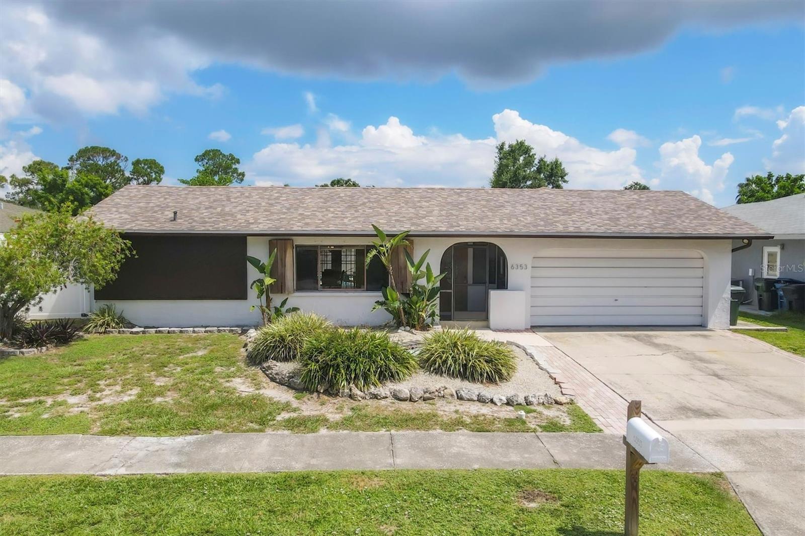 This 3 bedroom, 2 bathroom home has been remodeled throughout! Enjoy peace of mind with a new roof (2020), new plumbing (2021), and a stylish remodel to include new flooring, paint, bathrooms and kitchen. Lake Sarasota offers the freedom of no HOA and no CDD fees—bring your boat, RV, or other toys. As you enter you will find a spacious and open layout filled with natural light and soaring vaulted ceilings. At the front of the home is the formal living and dining room. The kitchen boasts a large island, quartz counter tops, and stainless steel appliances; it is truly the heart of the home as it is open to the large family room, with a unique wood burning fireplace, and French doors to the pool area; perfect for entertaining or everyday living. The primary is a comfortable retreat at the end of a long day with a en-suite bathroom and access to the pool. The other two bedrooms are located on the opposite side of the home and share a bathroom. Out back, unwind under your large covered entertaining area or in your private pool, which was recently resurfaced. Enjoy the fully fenced yard—ideal for pets, play, or outdoor gatherings. The 2 car garage offers extra storage. The home is move-in ready and the location delivers flexibility and convenience to shopping, dining, parks, and I-75.