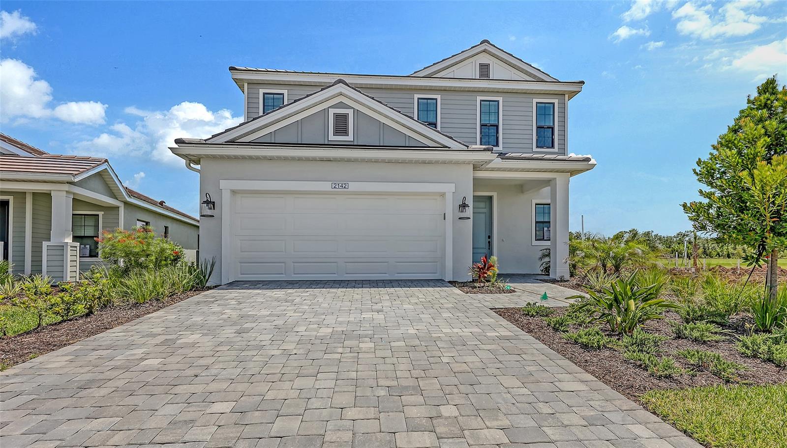 The Heritage is a 2-story, 4 bedroom, 2.5 bath single-family home featuring 2,428 sq.ft. of living space. The first floor holds a beautifully-equipped kitchen and over-sized walk-in pantry, offering plenty of space for culinary creativity. The oversized island and café area are the perfect setting to enjoy your meals or catch up with friends over coffee. The great room features sliding doors, where you can enjoy the view of your lanai in or outdoors. The master bedroom is located on the first floor, with dual sink vanities, a walk-in closet and corner shower.
Upstairs, there is a second bath, located between the second and third bedroom. Two of the bedrooms have walk-in closets, and all are anchored by a spacious loft that you can transform into an area reflecting your personal tastes. A 2-car garage and beautiful foyer complete the home.