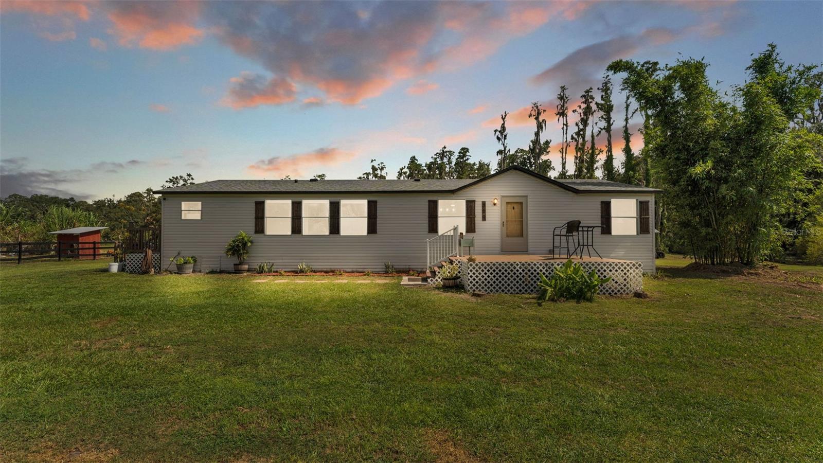 Welcome to your next adventure! This 3 bedroom, 2 bathroom home with a bonus room sits on nearly 10 acres of pure potential! The entire property is fully fenced offering endless possibilities for peaceful country living, recreation, or future expansion. The roof is BRAND NEW, installed April 2025. The home also features a whole-home water softener system and water heater, both replaced in 2020. The kitchen and flooring have been tastefully updated to offer a warm, rustic feel, complemented by newer appliances throughout. The primary suite features a spacious walk-in closet and an ensuite bathroom complete with a garden tub and separate shower. Outside, the property shines with thoughtful features like 3 gated entry points, a bridge that crosses over the creek leading to an open back field, perfect for exploring or a secluded future homesite. Out back you will find a 12x20 shed and a shop lovers dream: A spacious 30x50 workshop complete with a 14x30 lean-to/carport on the east side and a massive 14x50 extension on the south side, ideal for storing equipment, vehicles, RVs, or anything else your lifestyle demands. Whether your gardening, fishing in your private creek, or exploring the back acreage by ATV or horseback, this property offers room to grow and roam. Come experience the lifestyle that only wide-open space can offer! USDA eligible.