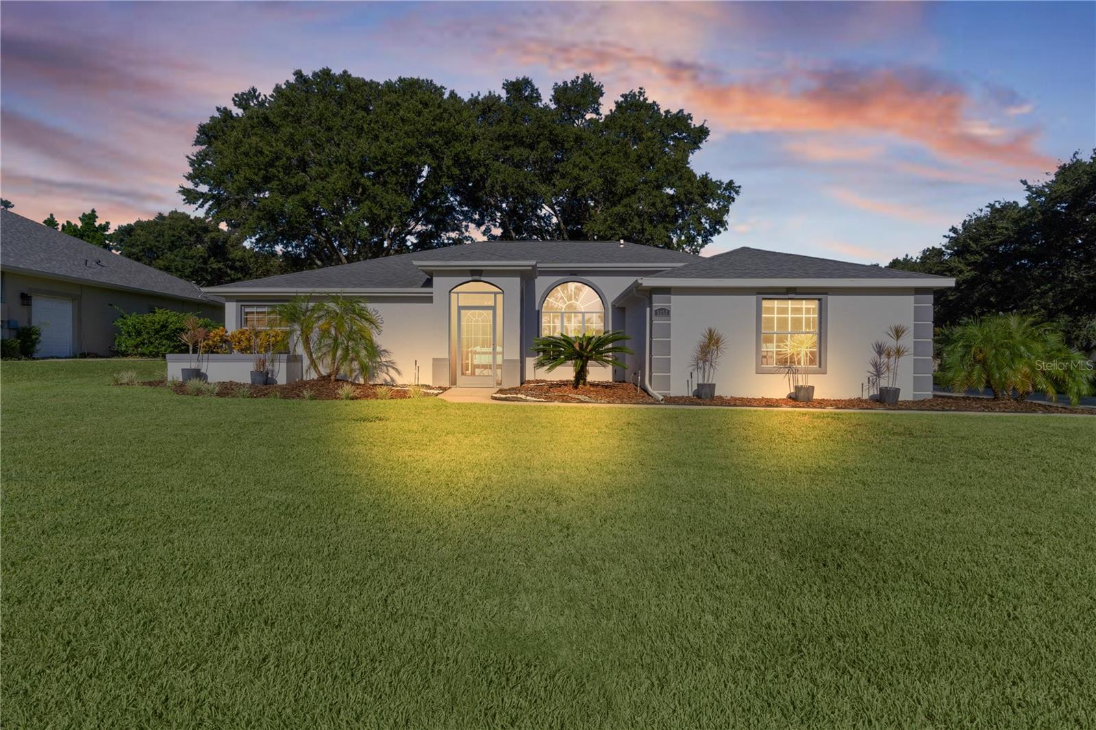 Home improvements: Roof 2020 AC 2014 Hot Water Heater 2014. TRANSFERABLE Broward Home Warranty. Home painted (2020) In 2021: Ducts cleaned, new garage door, ($2000!) water filtration system ($7000 value!), plumbing repiped through the home ($10,000). Septic pumped in 2024. Especially relevant for those with allergies or asthma who need better air quality-Stanley Steamer Restore UV light system installed in 2022($1200). All these additional items make this home a better choice over new with all the mature landscaping that makes the entire neighborhood feel like home! Can it get any better! Maybe...check out the updates INSIDE the home! There is nothing you need to do but move in (especially if you are in love with the furniture and decor which is available separately!). The light-colored Granite and quartz counters throughout the home add to the light, bright feel that everyone is looking for but is so hard to find! Continuous vinyl plank floor in every room seems to increase the sq footage giving the illusion that there is even more than 2019 sq foot. The open area of the dining room and living room, when entering the home contributes to the open floor plan in which the kitchen overlooks a large family room. The spectacular feature wall with shiplap and an electric fireplace ($2000) is a great area to get cozy and feel the ambiance created! The bonus room (not included in sq ft) has so many possibilities depending on your needs. Updates in the primary bathroom include resurfacing of the shower (with warranty)shiplap & paint($4000)! Bedrooms 2&3 with the guest bath are located on the opposite side of the home from the Primary bedroom for the utmost privacy. Outside living is turned up on this home! The twinkle lights in the screened lanai really set the mood for a relaxing evening when the weather is cooler to enjoy Florida at its best! Those magnificent mature trees even allow you to enjoy this outdoor area, including the paved patio when it is a little warmer outside! This is such a great place to relax, read a book or enjoy company with friends and family! The side yard gives so much more outdoor space than the average home site for you and/or your family to enjoy especially with the shade provided so it’s cooler year-round! This is the only homesite in the neighborhood with a side entry garage! This gives you more driveway space that is so convenient, especially if you have more than two cars. There is ample space to park a vehicle away from the house with plenty of room to maneuver cars out of the garage without needing to play the infamous game: "Hey, can you move your car!” HOA of $77/month which includes a manned gate! Residents may choose to become social members at the clubhouse for an additional fee. There is even a playground on the clubhouse grounds! Please call clubhouse for information on packages available depending on what features you would like to enjoy such as pickleball, tennis, indoor racquetball, sauna and weight room. The breathtaking views overlooking lake griffin from the gorgeous pool might alone just be with the membership! If you would rather be on the lake than observing the view, there is also an opportunity to use the marina! The clubhouse restaurant is just perfect for your needs after golfing, swimming or boating. If you decide to take advantage of the activities at the clubhouse there are several to choose from! All information deemed reliable but should be independently verified.