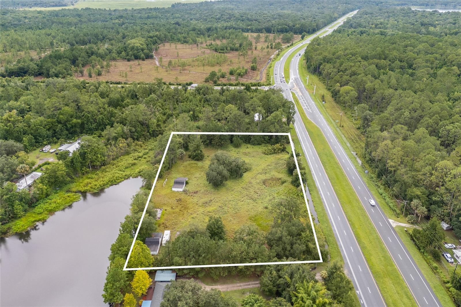 Endless Possibilities on 2.83 Acres in Historic Micanopy!
Don’t miss this rare opportunity to own two side-by-side parcels totaling 2.83 acres with C2 zoning, offering a wide range of commercial possibilities. Located just off US-441 with excellent visibility and access, this property is ideal for a variety of business ventures or future development. Property features include two enclosed barns perfect for storage, workshops, or conversion to fit your needs. Whether you're looking to expand your business or invest in a growing area, the potential here is unmatched.